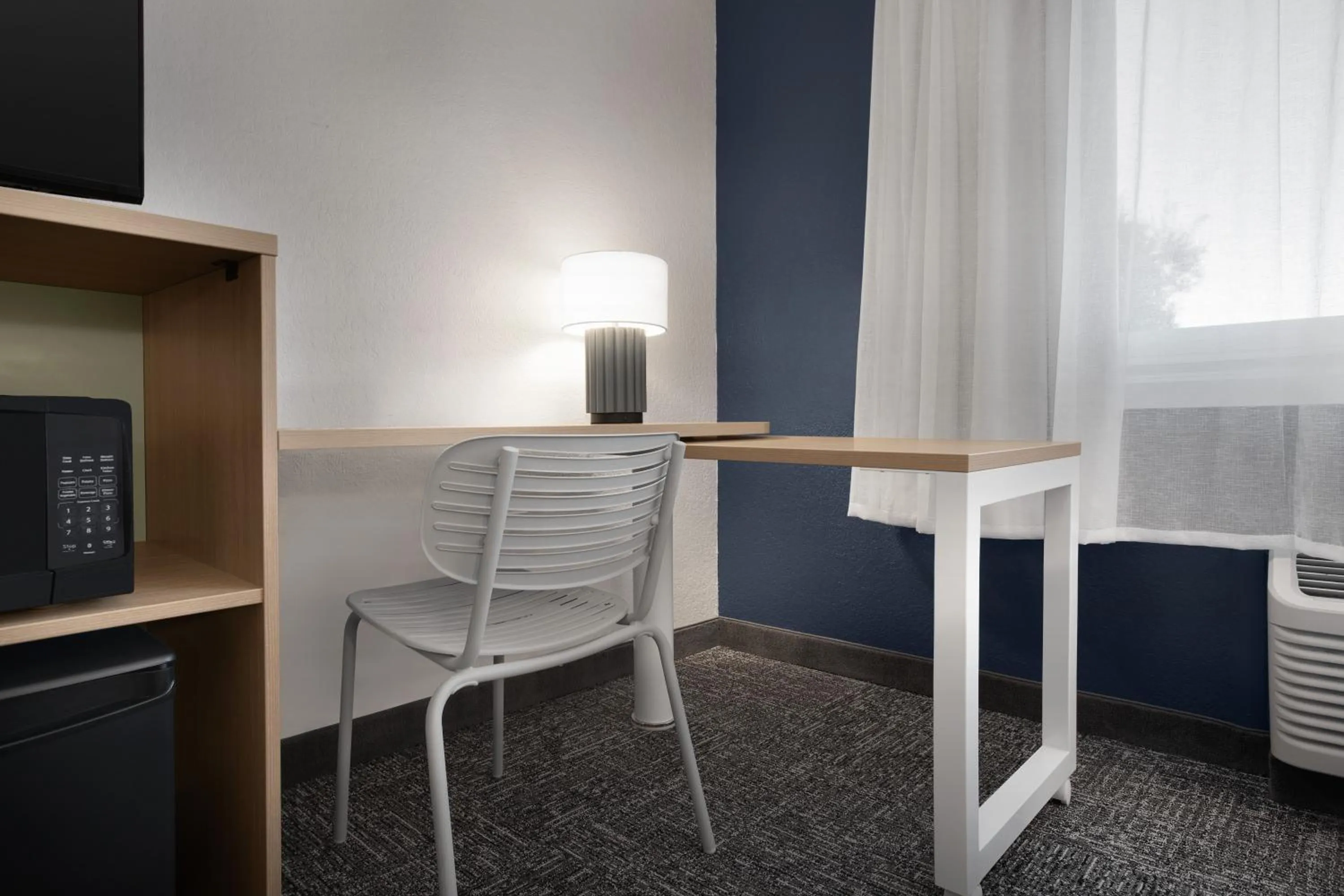 Living room in La Quinta by Wyndham San Jose Airport