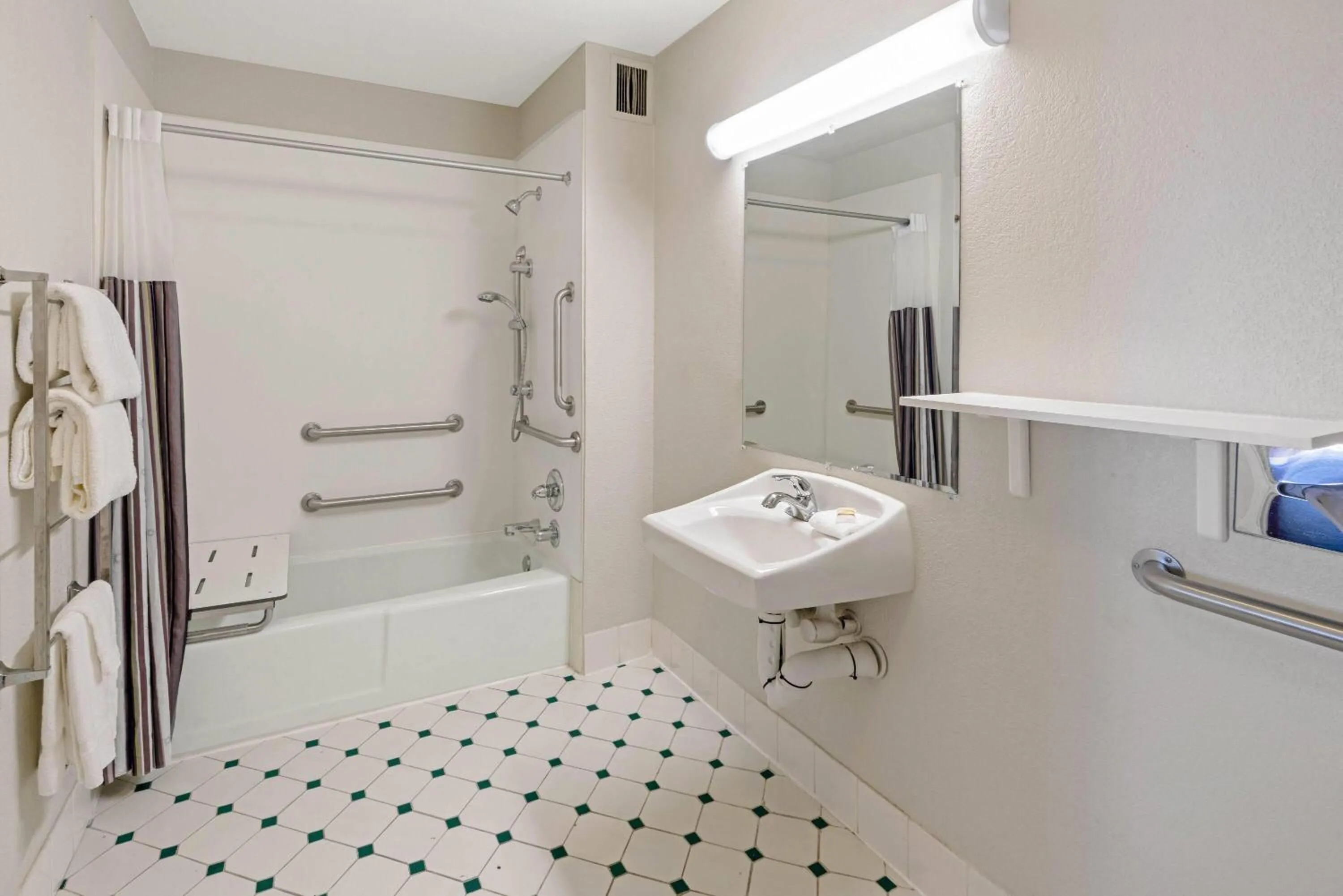 Bathroom in Travelodge by Wyndham Phoenix North