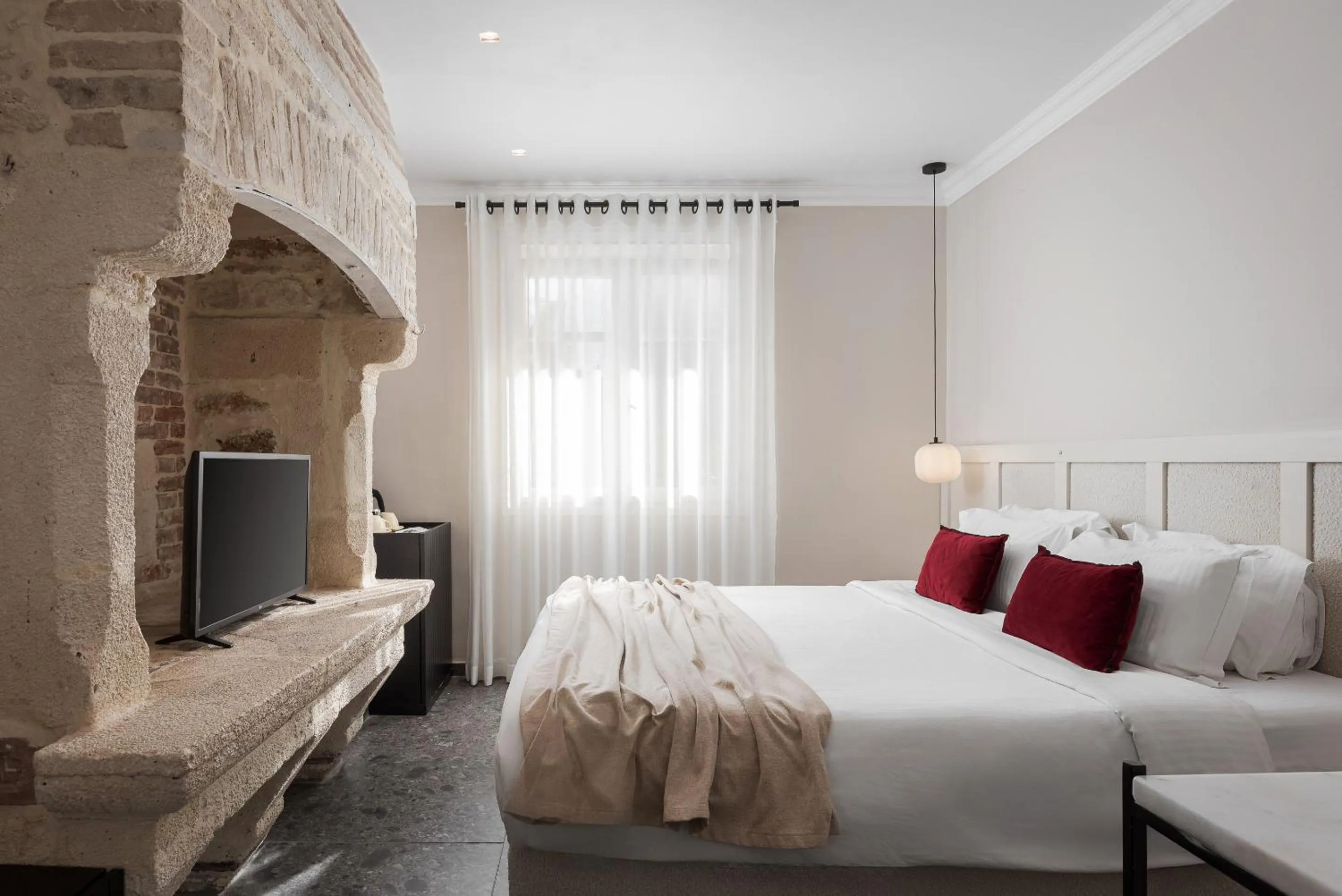 Bed in Civitas Suites Hotel