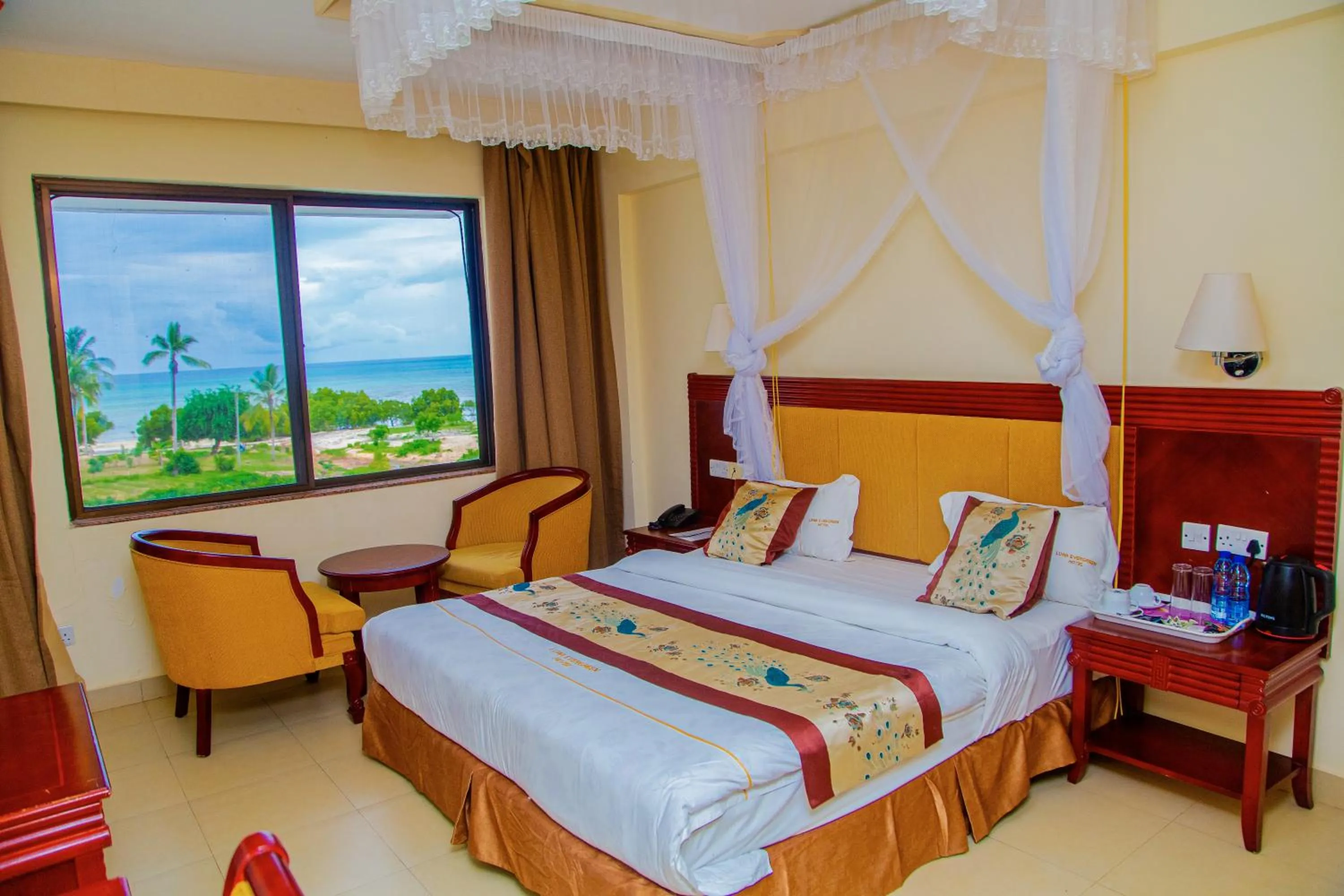 Bed in Luwa Evergreen Hotel