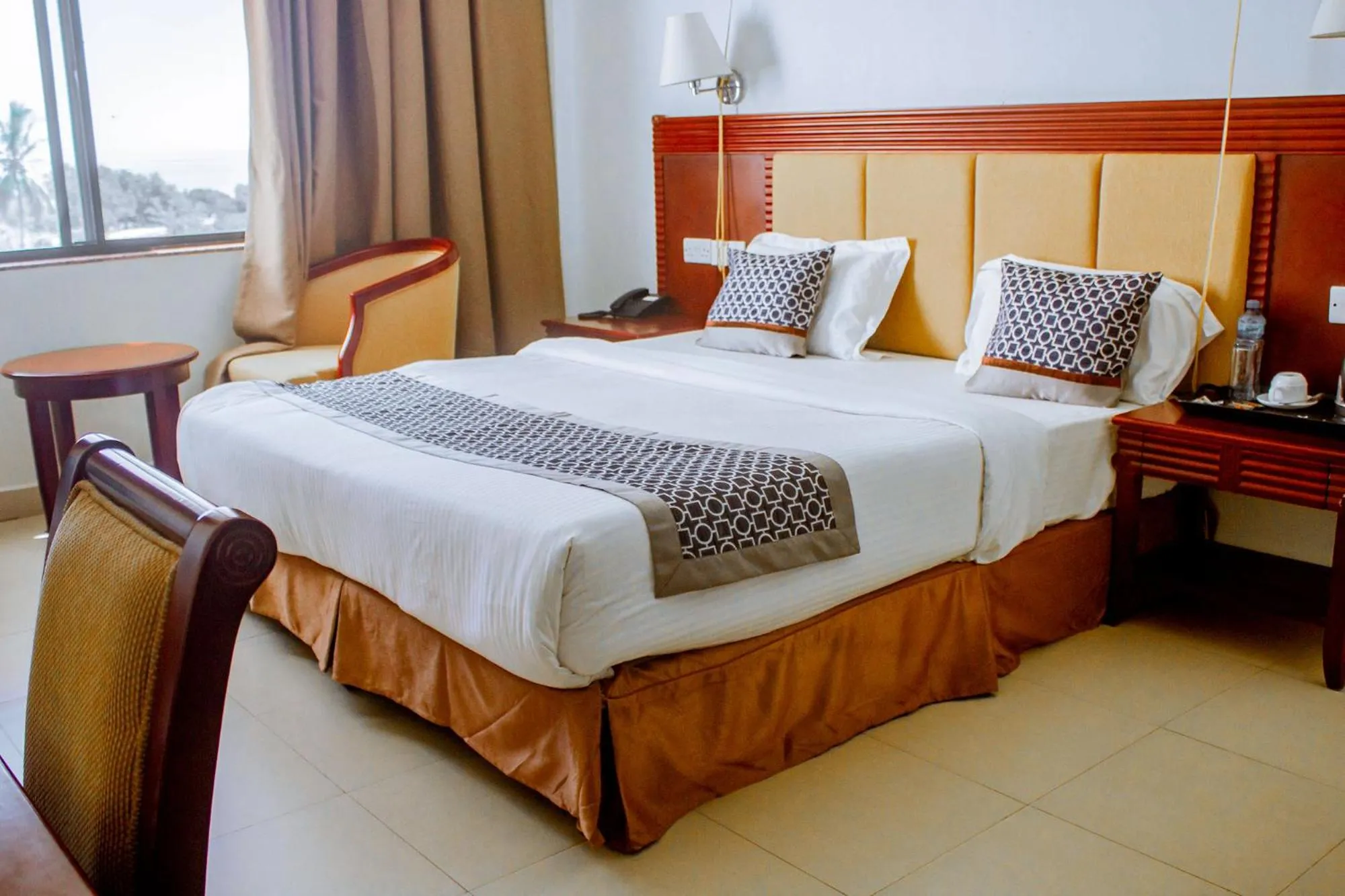 Bed in Luwa Evergreen Hotel