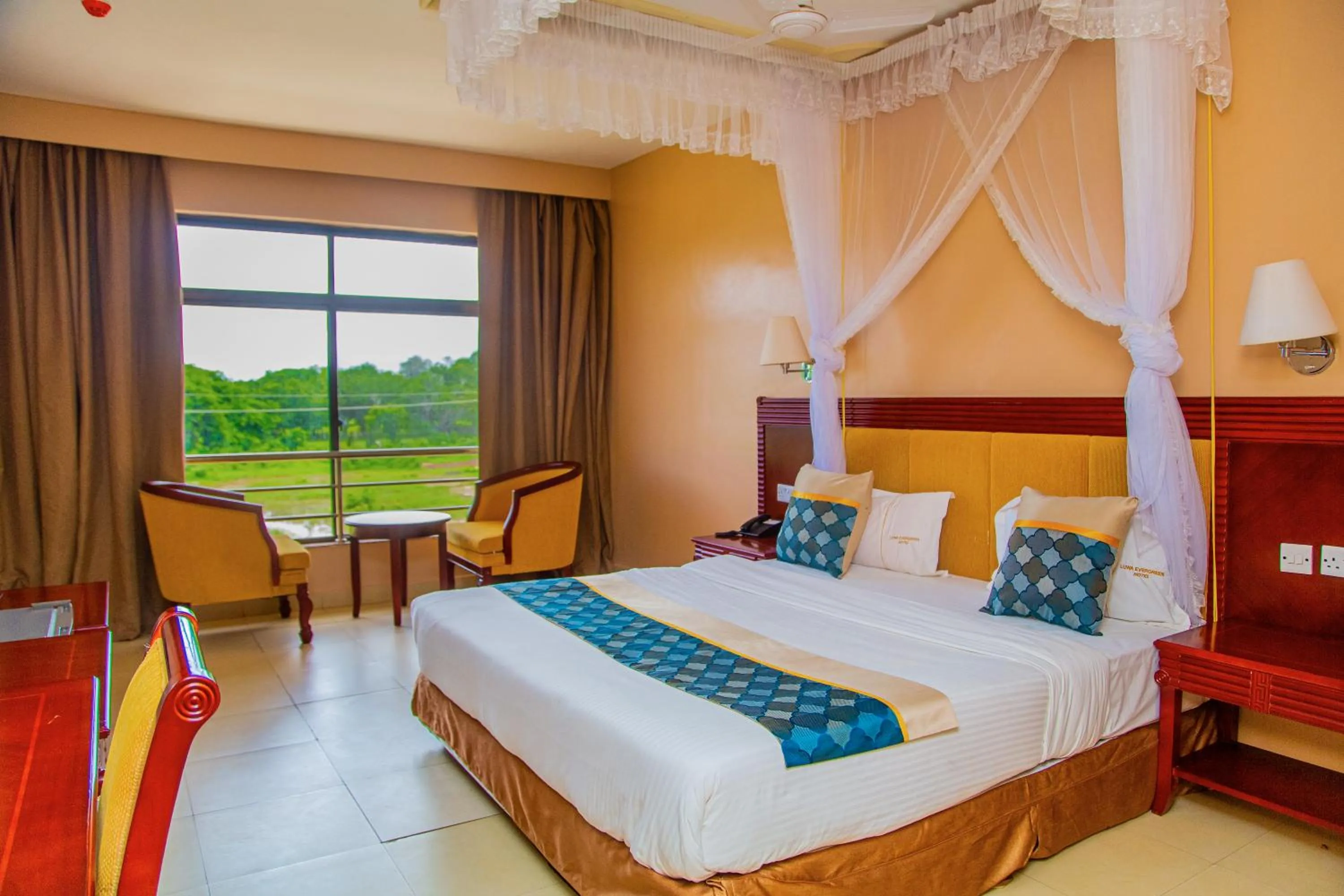 Bed in Luwa Evergreen Hotel