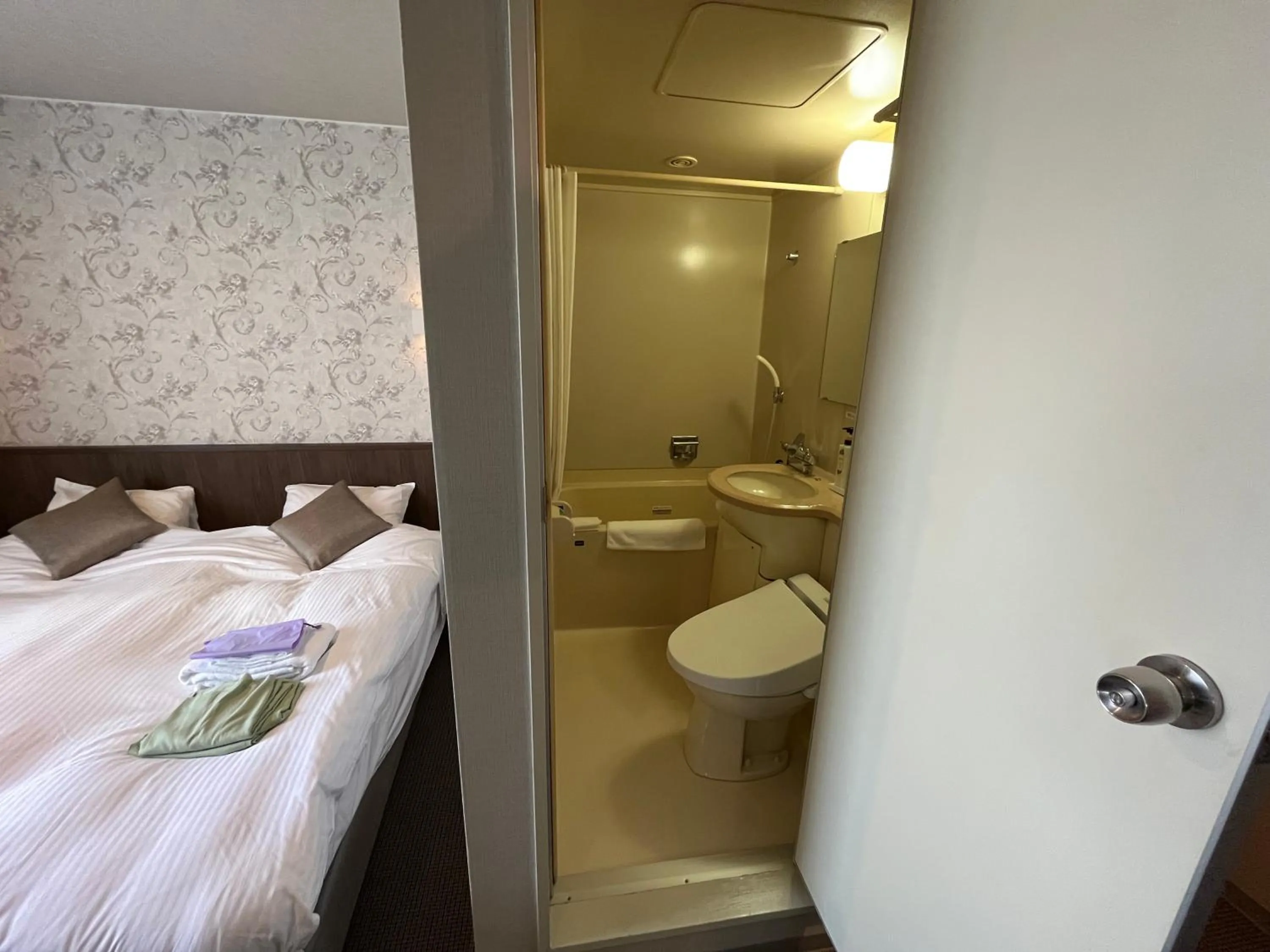 Bathroom, Bed in Monbetsu Prince Hotel