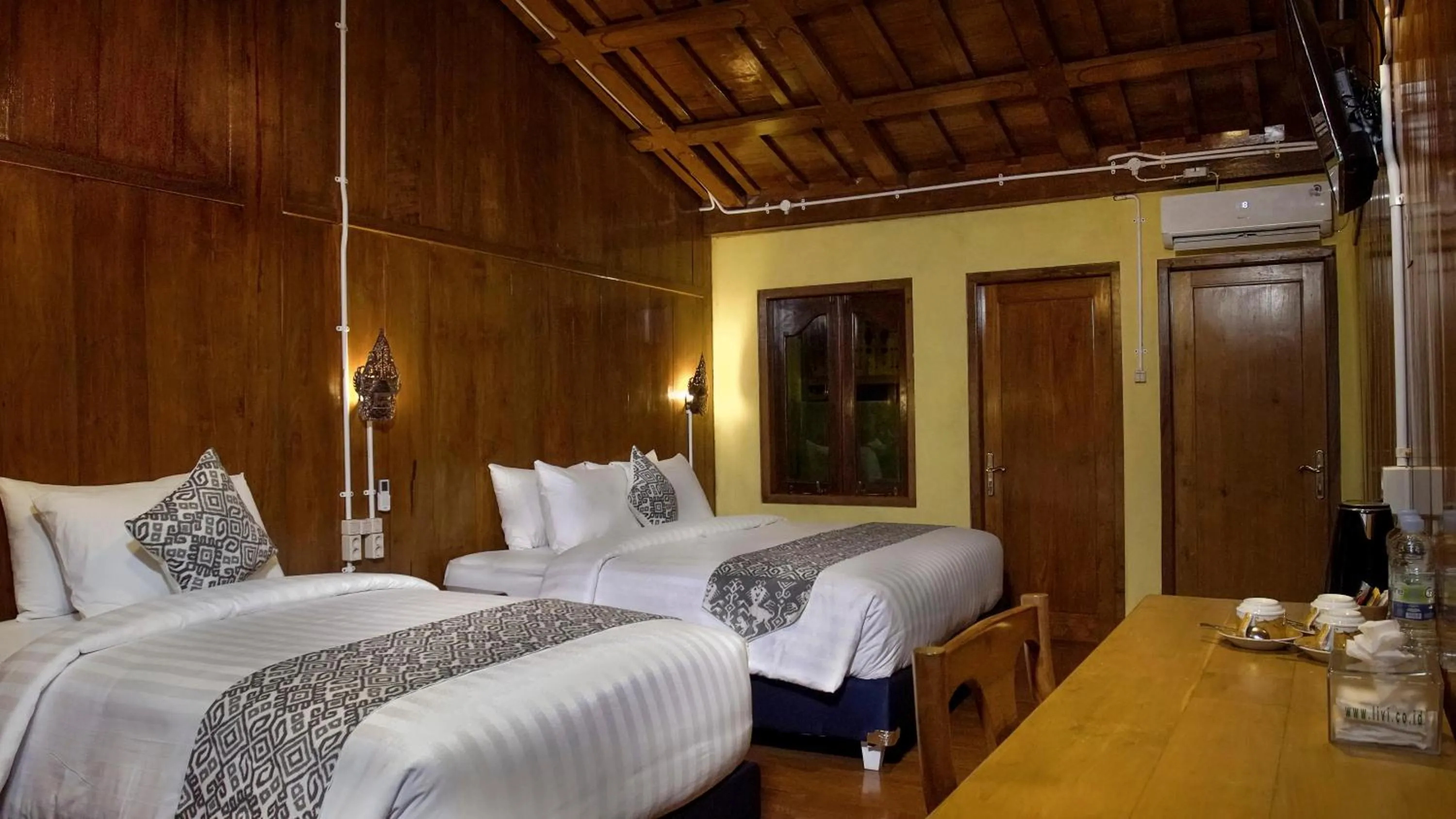 Bed in Kampoeng Joglo Boutique Hotel