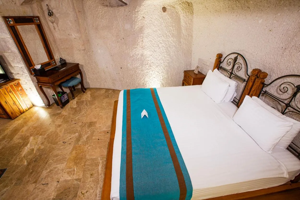 Bed in Imperial Cave Suites & Spa