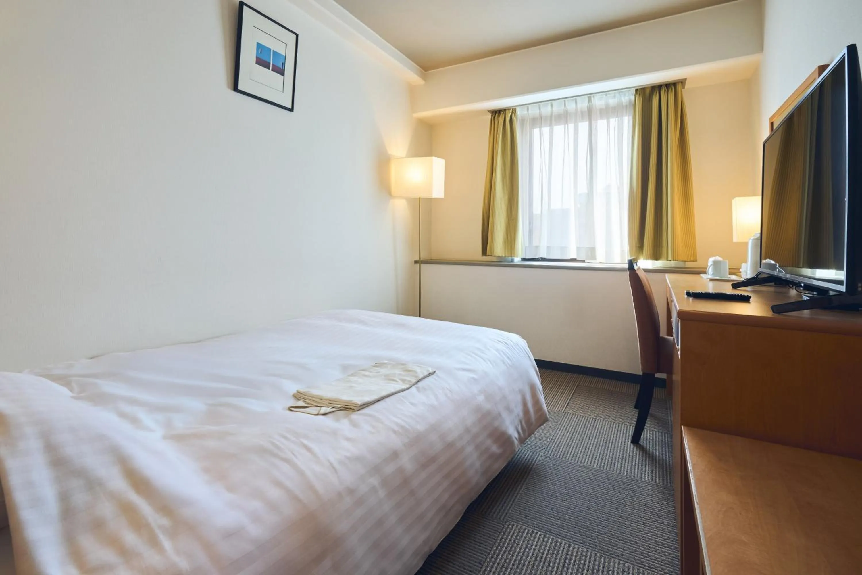 Photo of the whole room, Bed in Hotel Lexton Kagoshima