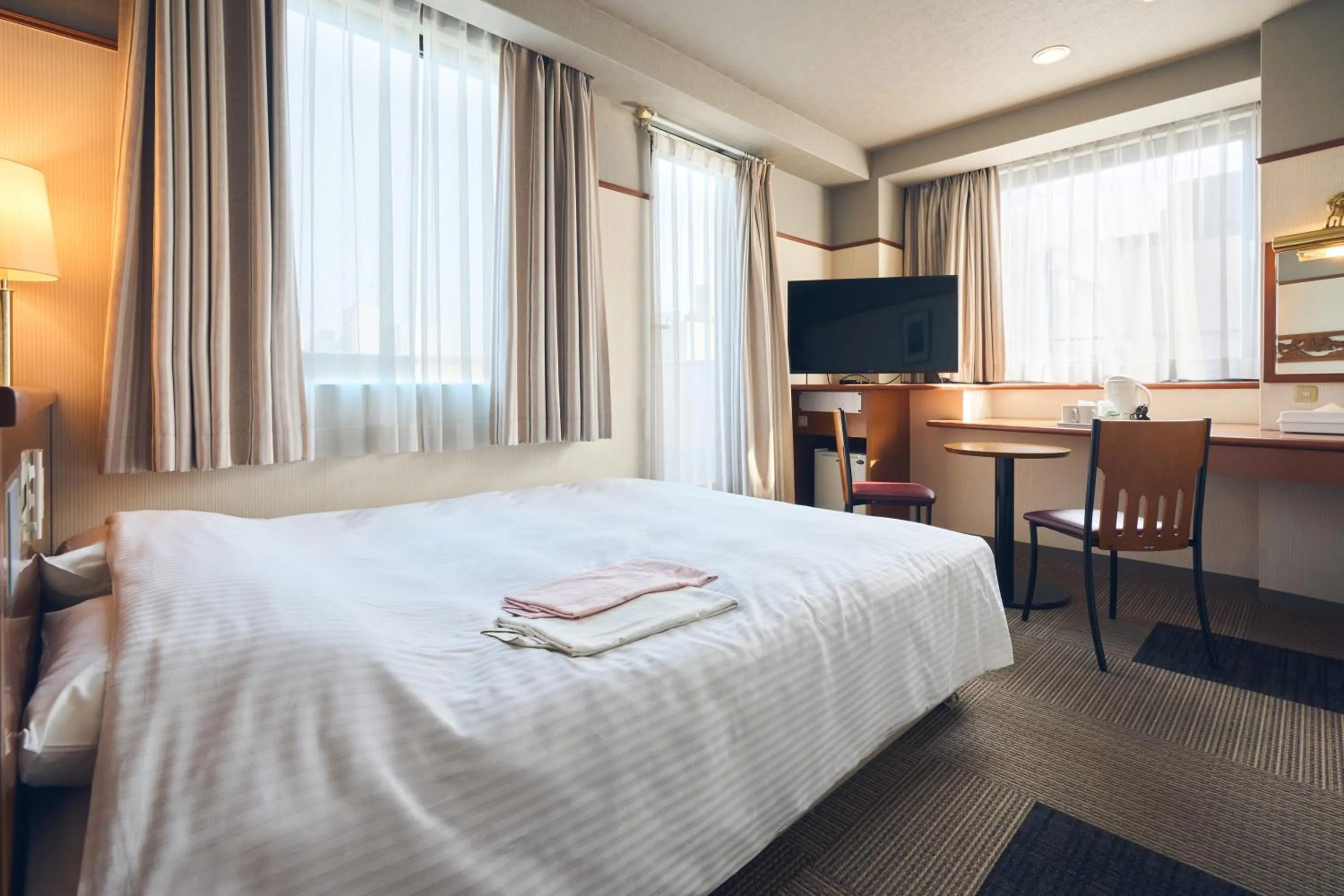 Photo of the whole room, Bed in Hotel Lexton Kagoshima