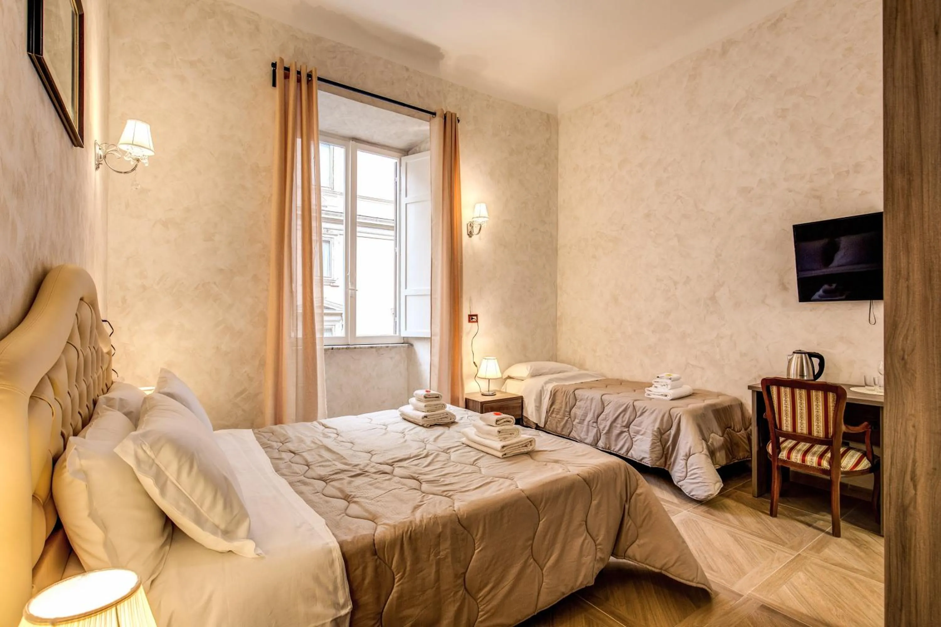 Bed in AMICI GUESTHOUSE