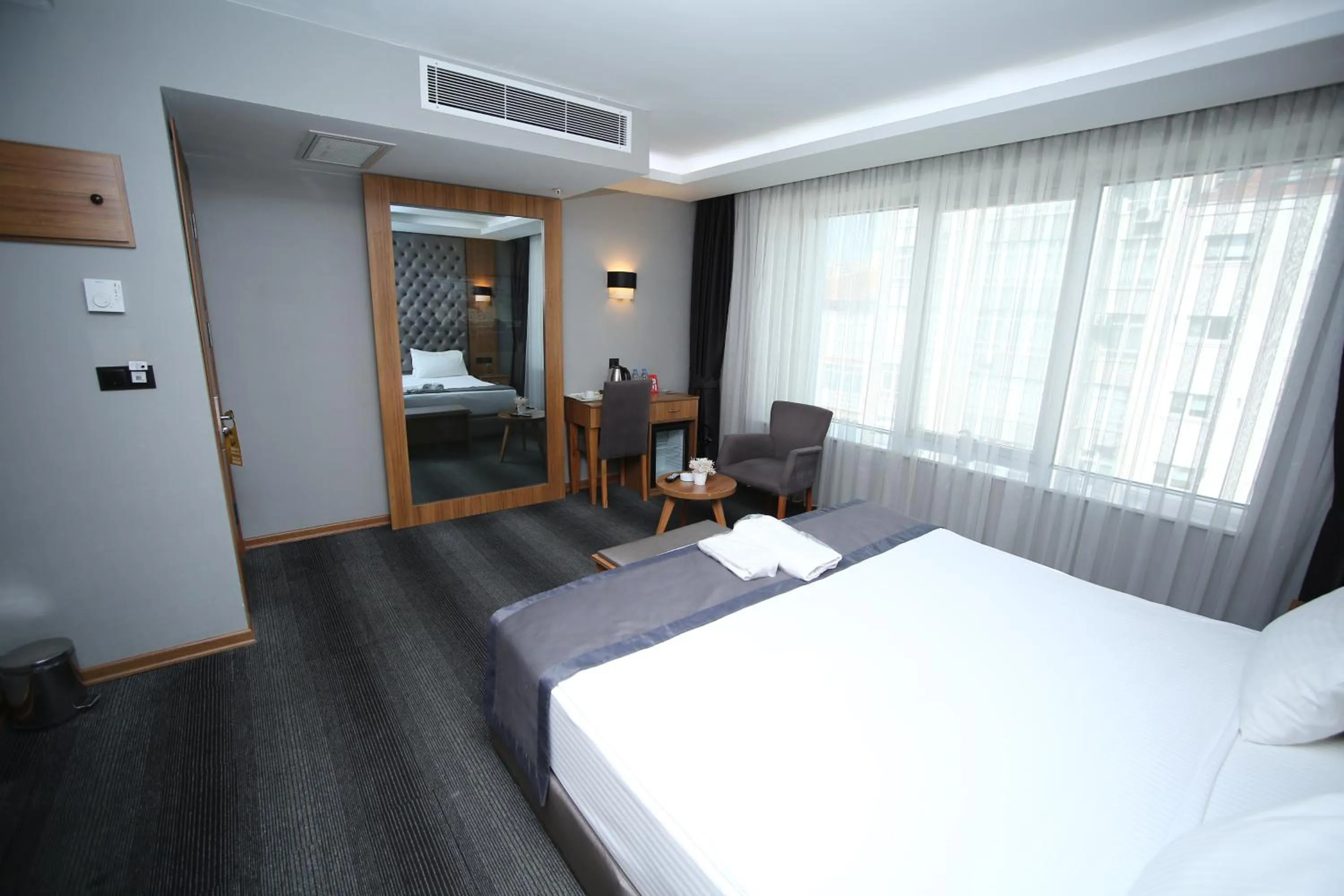 Bed in Grand Silay Hotel