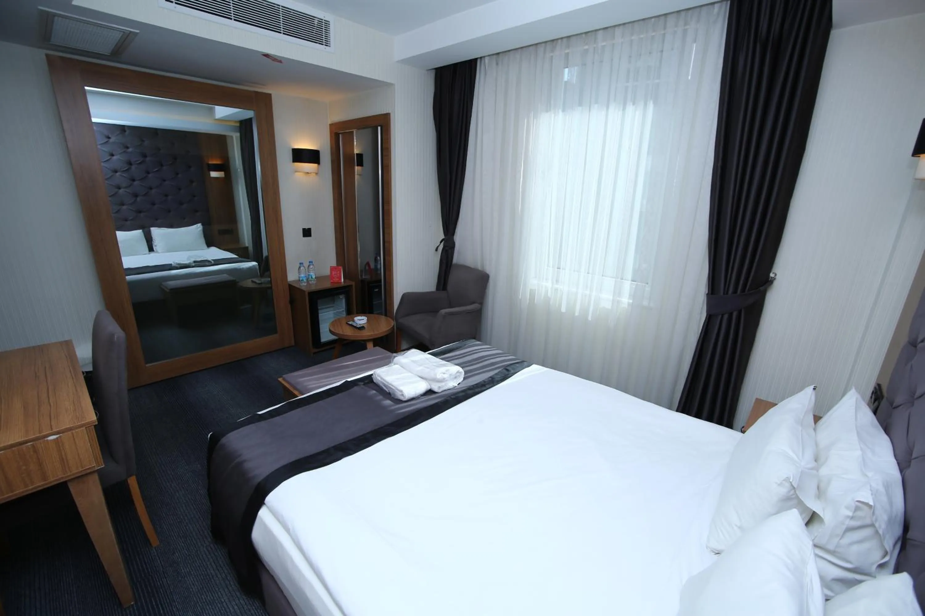 Bed in Grand Silay Hotel