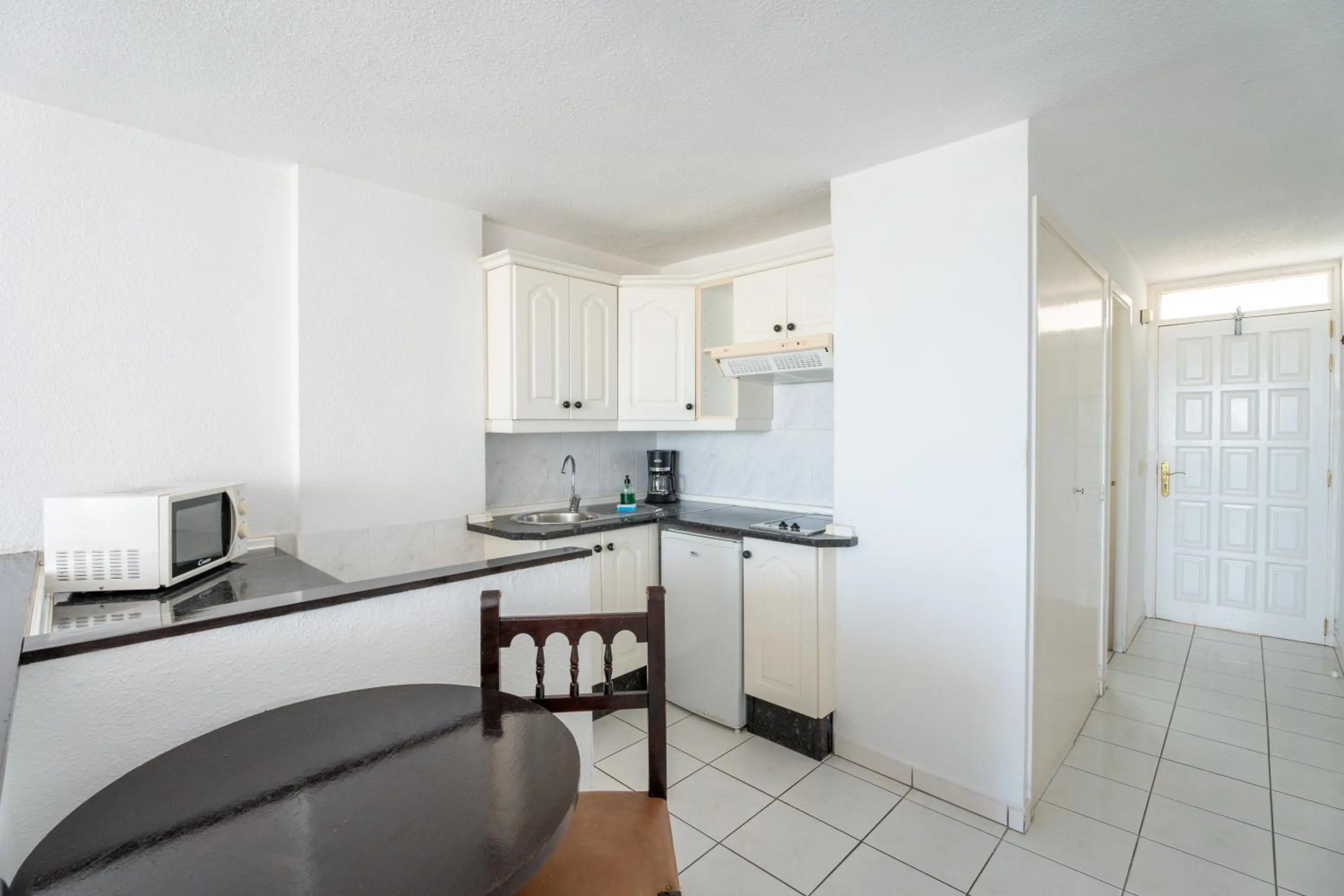 Kitchen or kitchenette in Apartamentos Borinquen