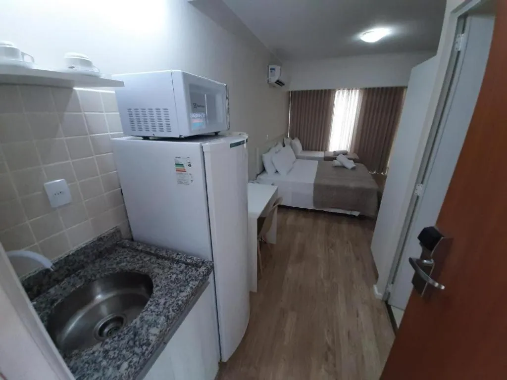 Kitchen or kitchenette in Caravaggio Praia Hotel