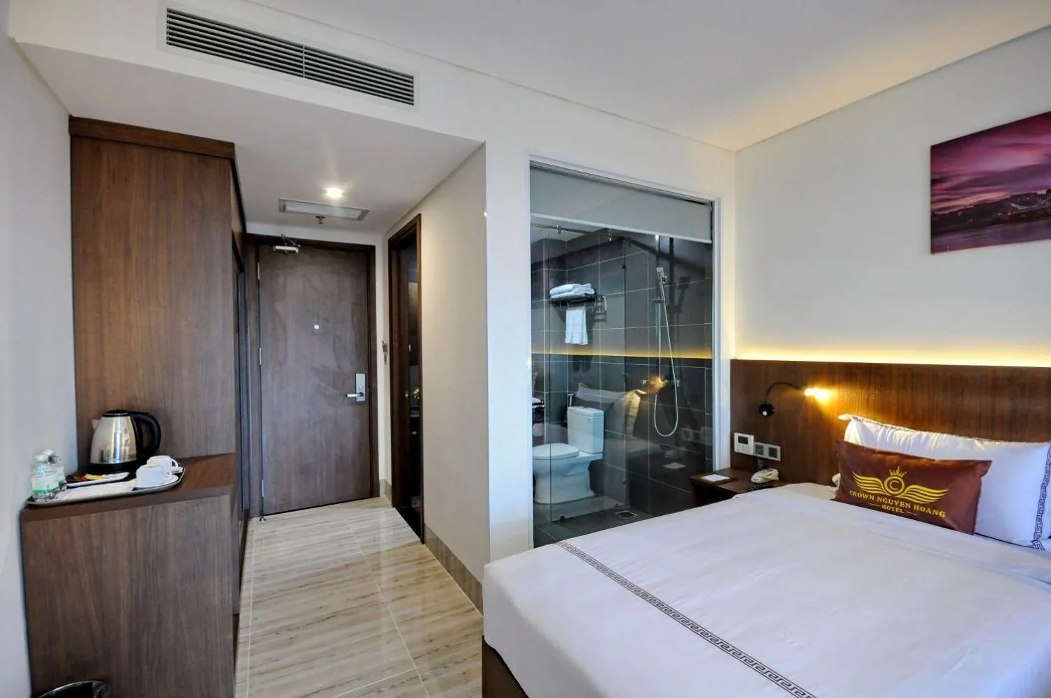 Bed in Crown Nguyen Hoang Hotel