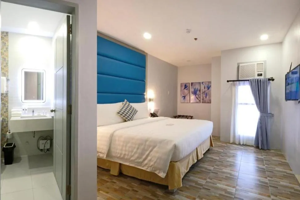 Bed in Amethyst Boutique Hotel Cebu powered by Cocotel