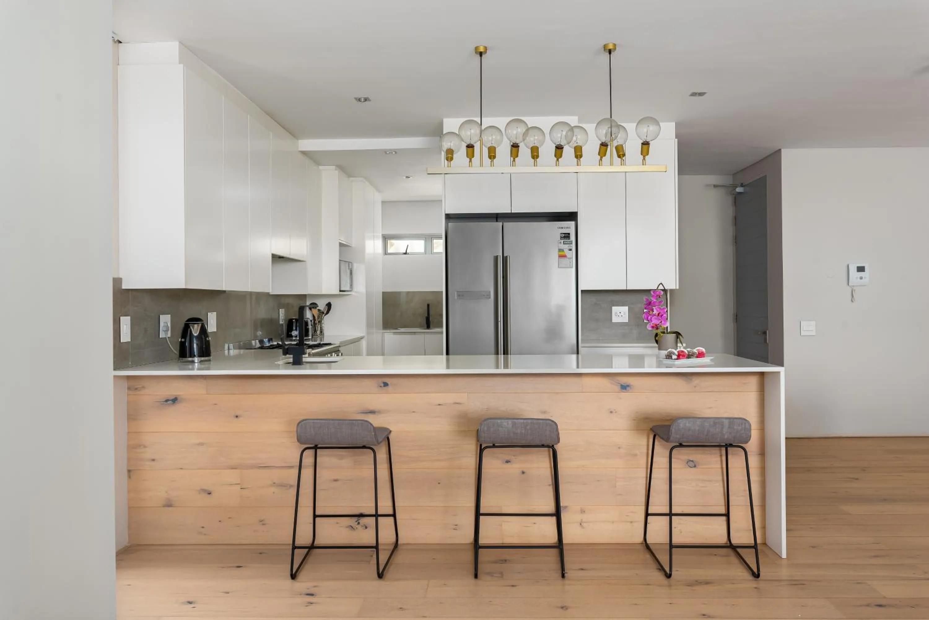 kitchen in Elements Luxury Suites by Totalstay