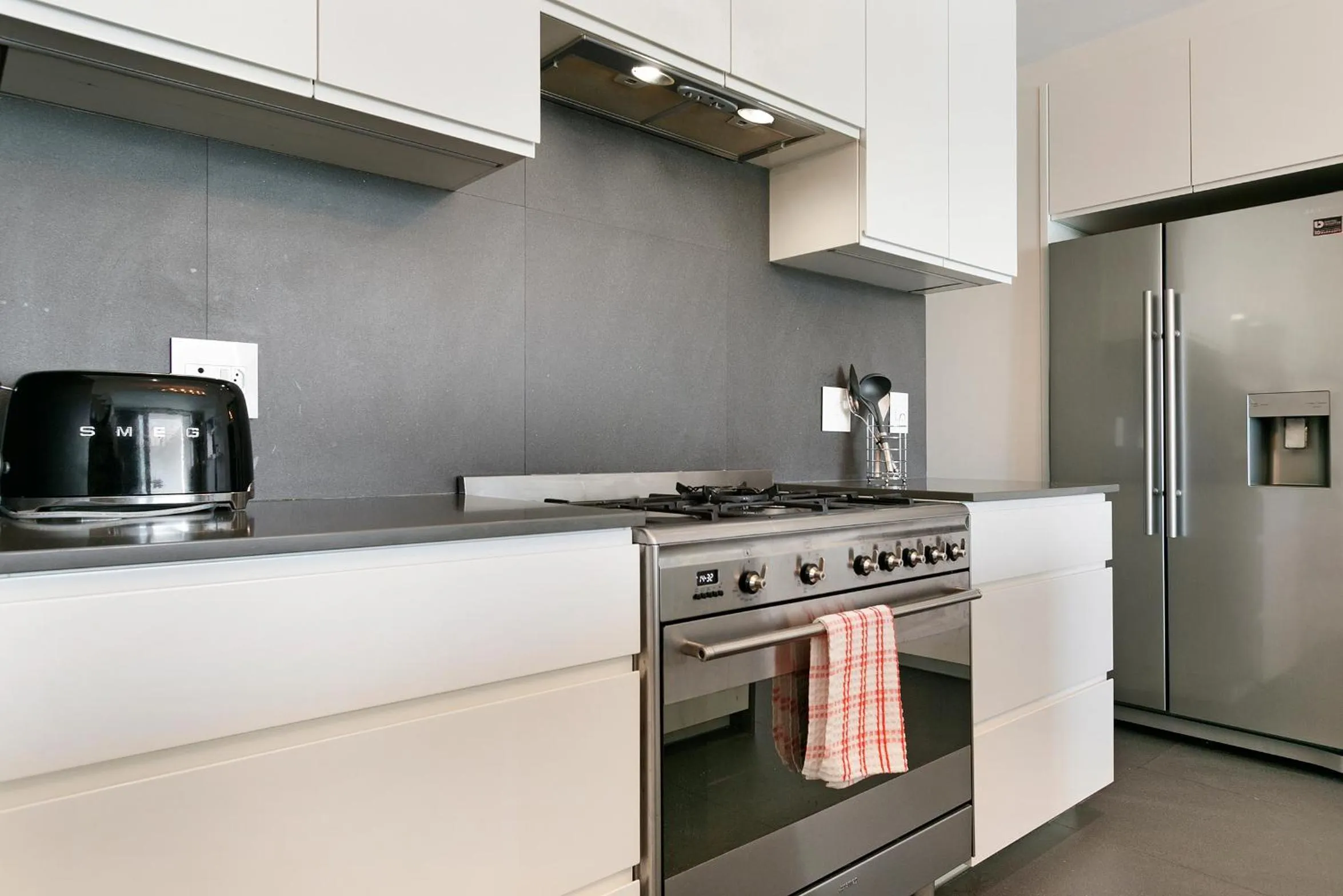 kitchen in Elements Luxury Suites by Totalstay
