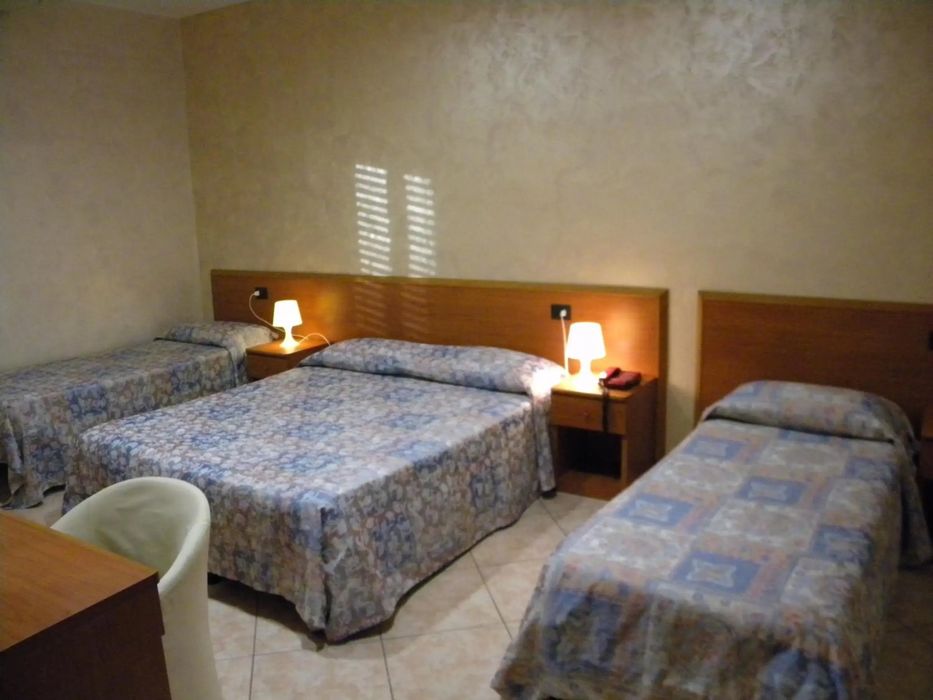 Quadruple Room in Hotel Toscano Quadruple Room in Hotel Toscano