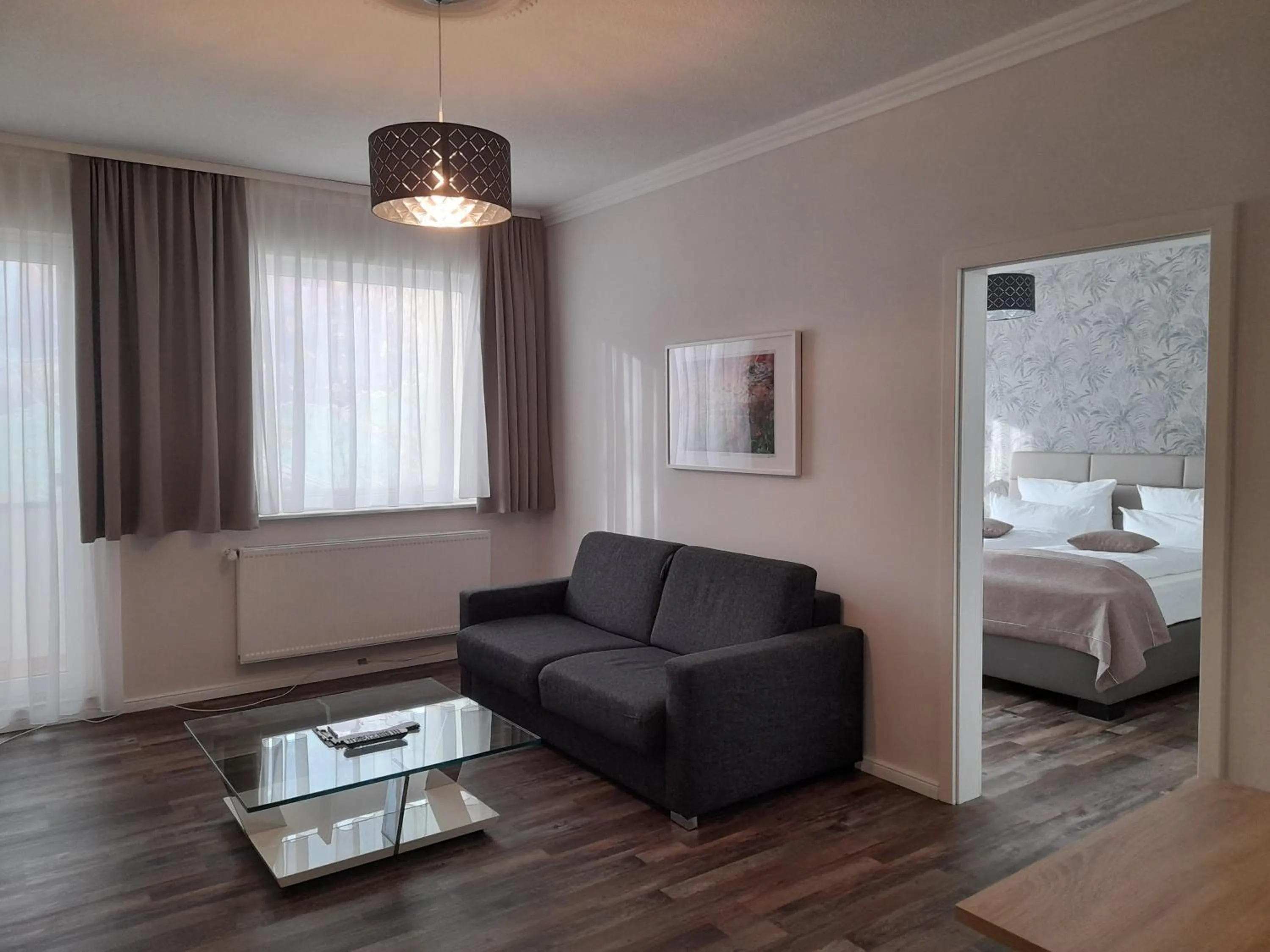 Seating area, Bed in Design Apartments Bremen