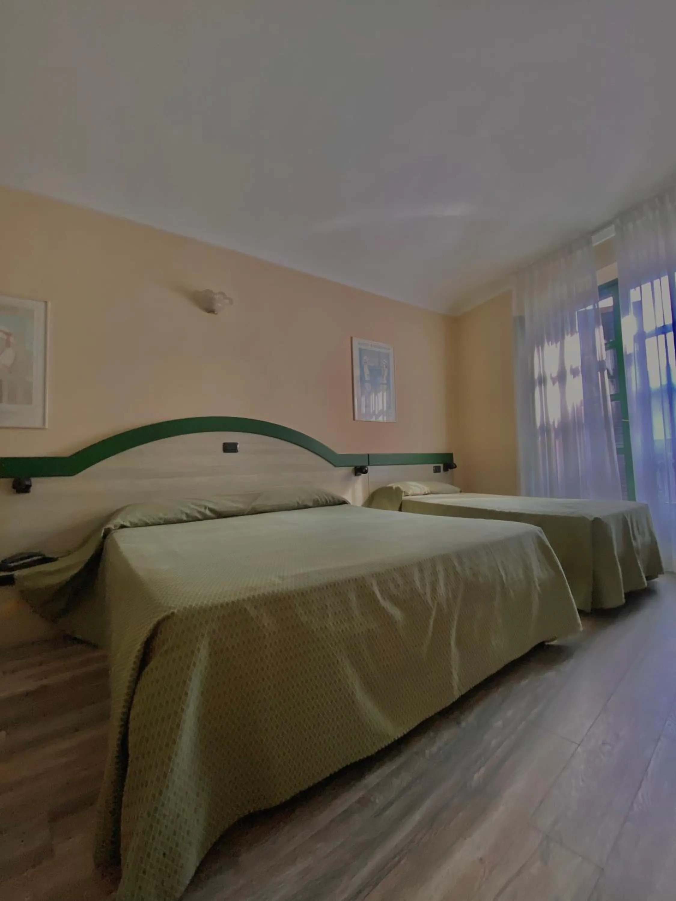 Bed in Hotel Rainero