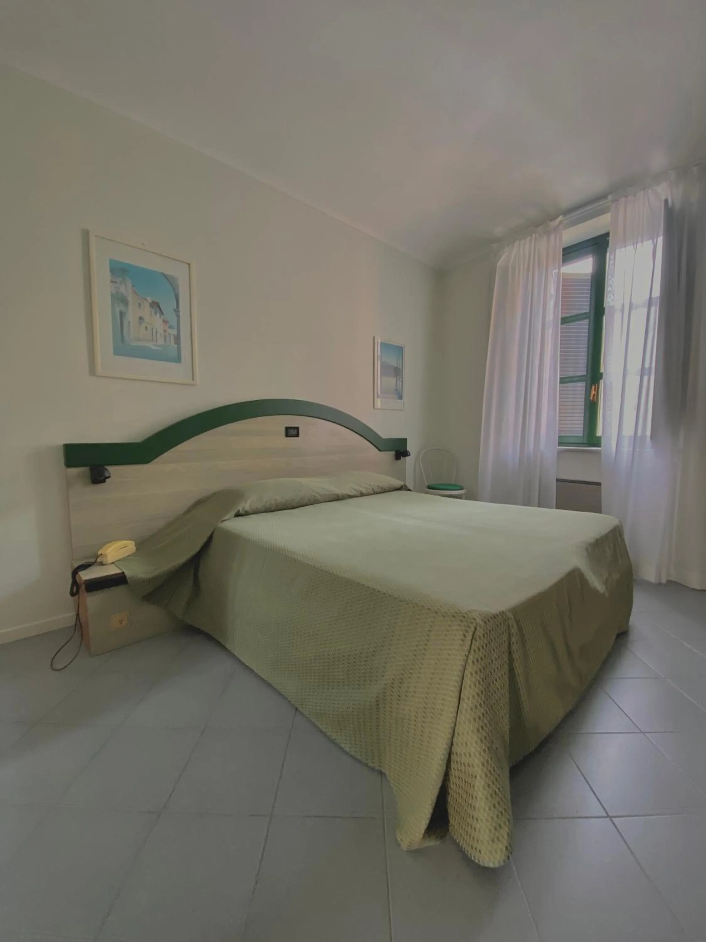 Bed in Hotel Rainero