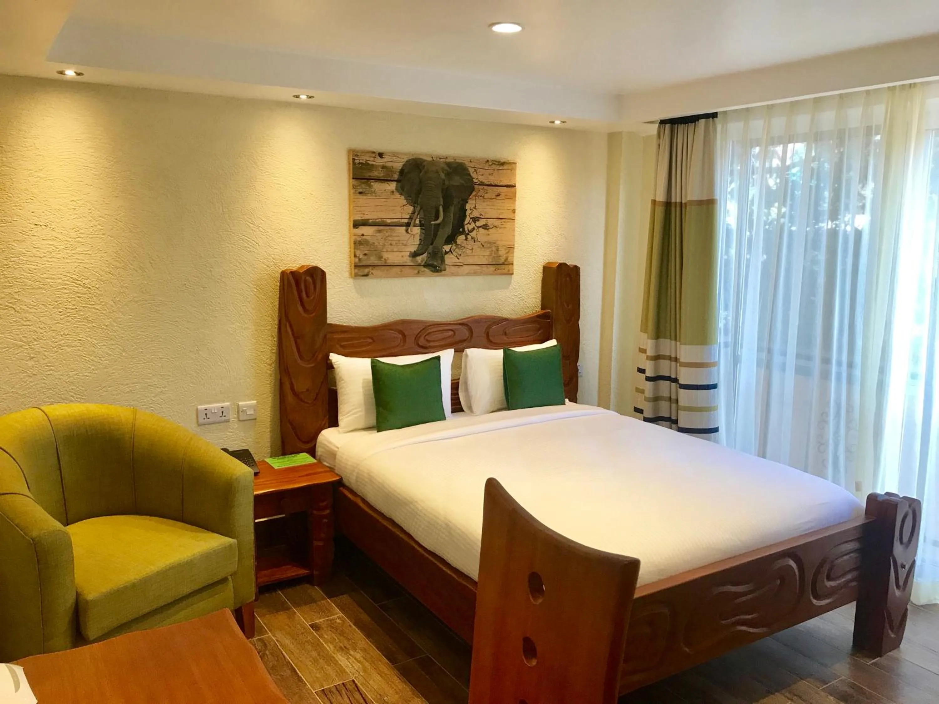 Bed in Progressive Park Hotel