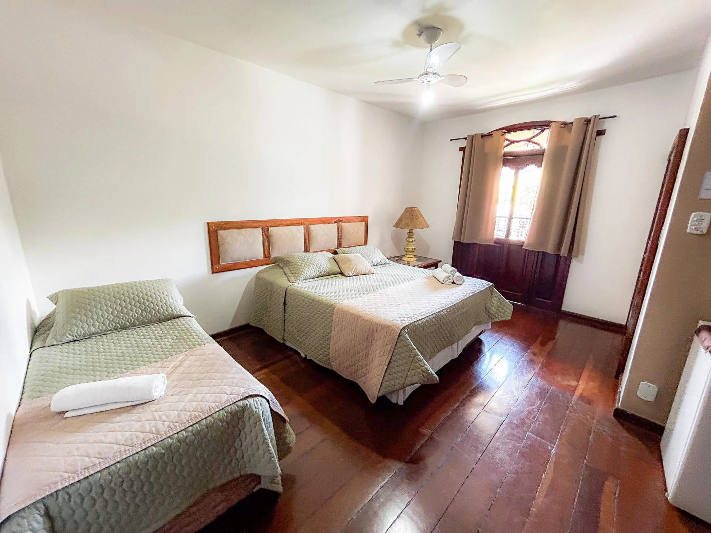 Bed in Pousada dos Sinos