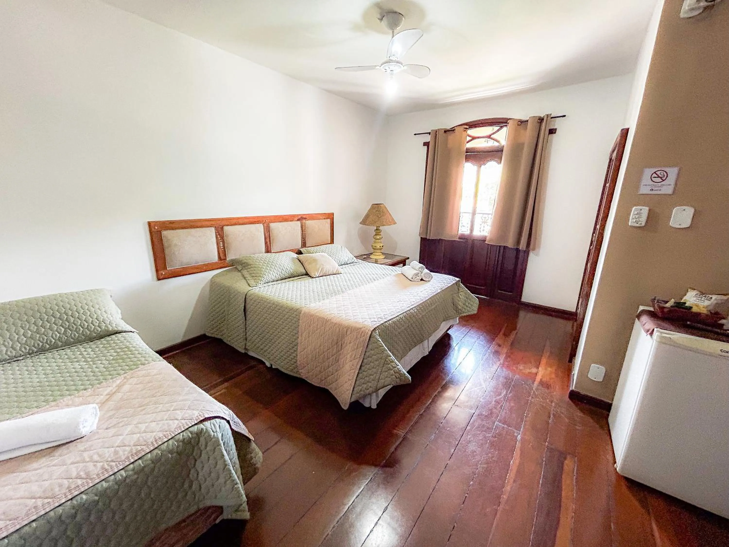 Bed in Pousada dos Sinos