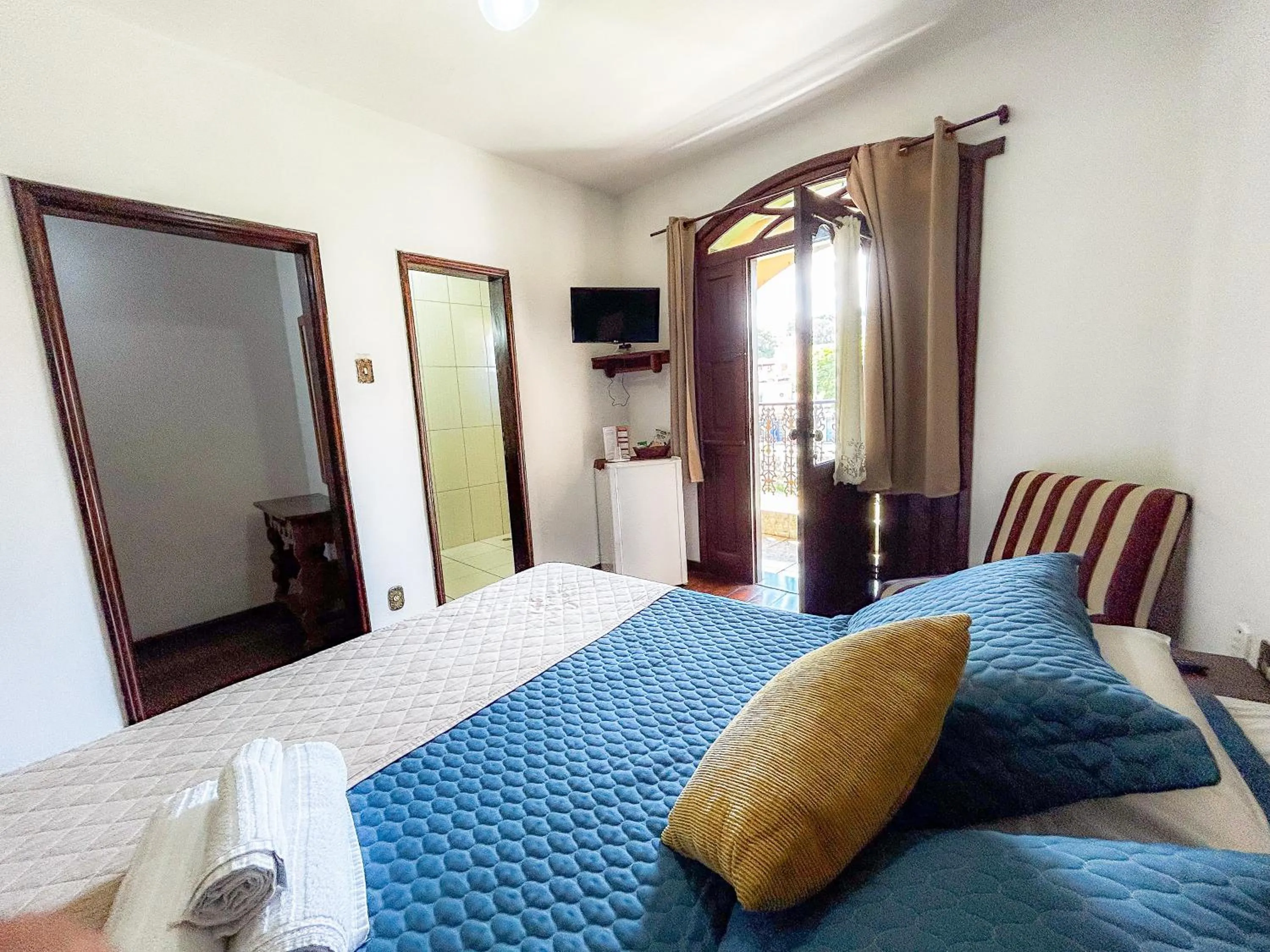 Bed in Pousada dos Sinos