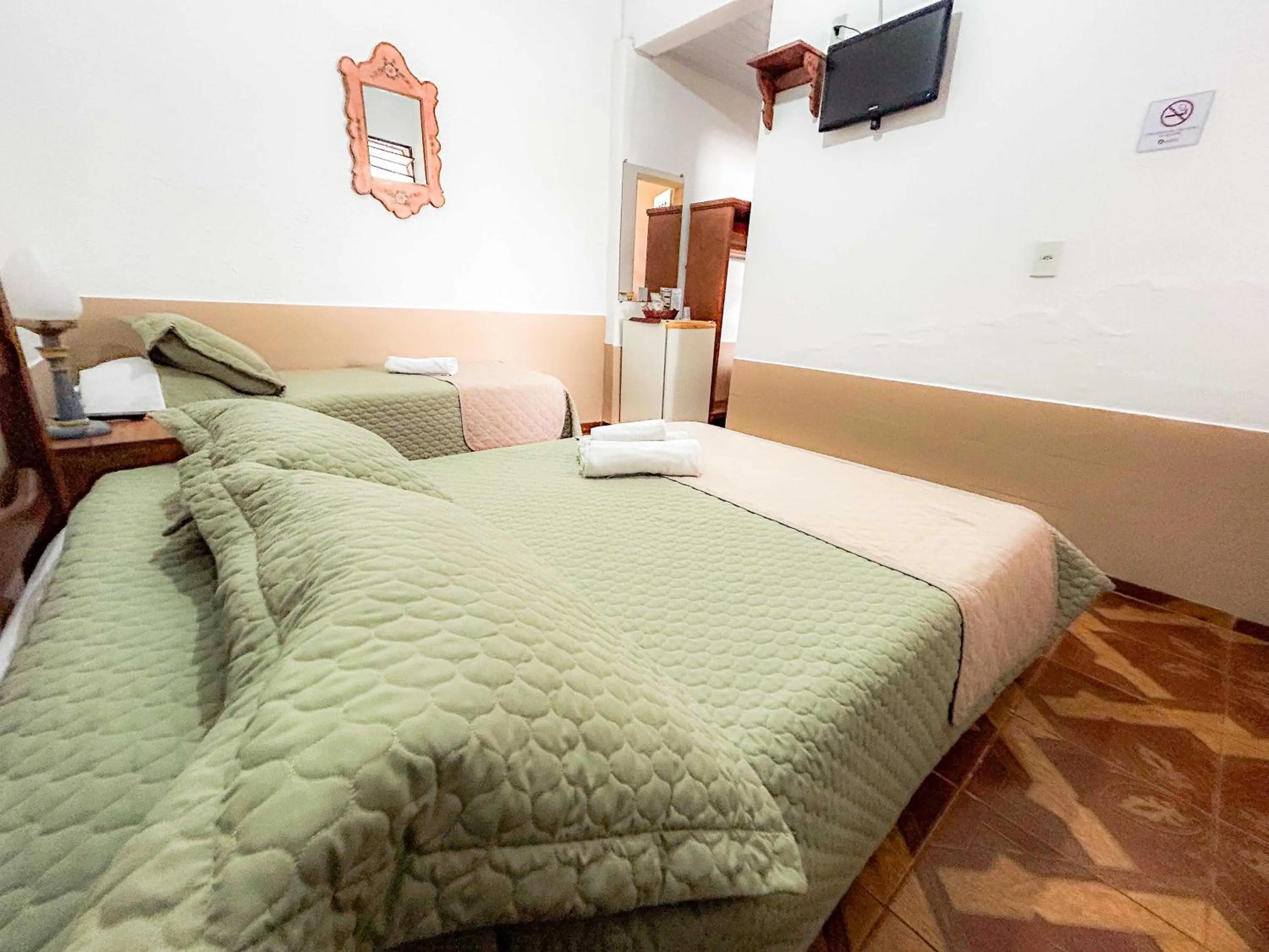 Bed in Pousada dos Sinos