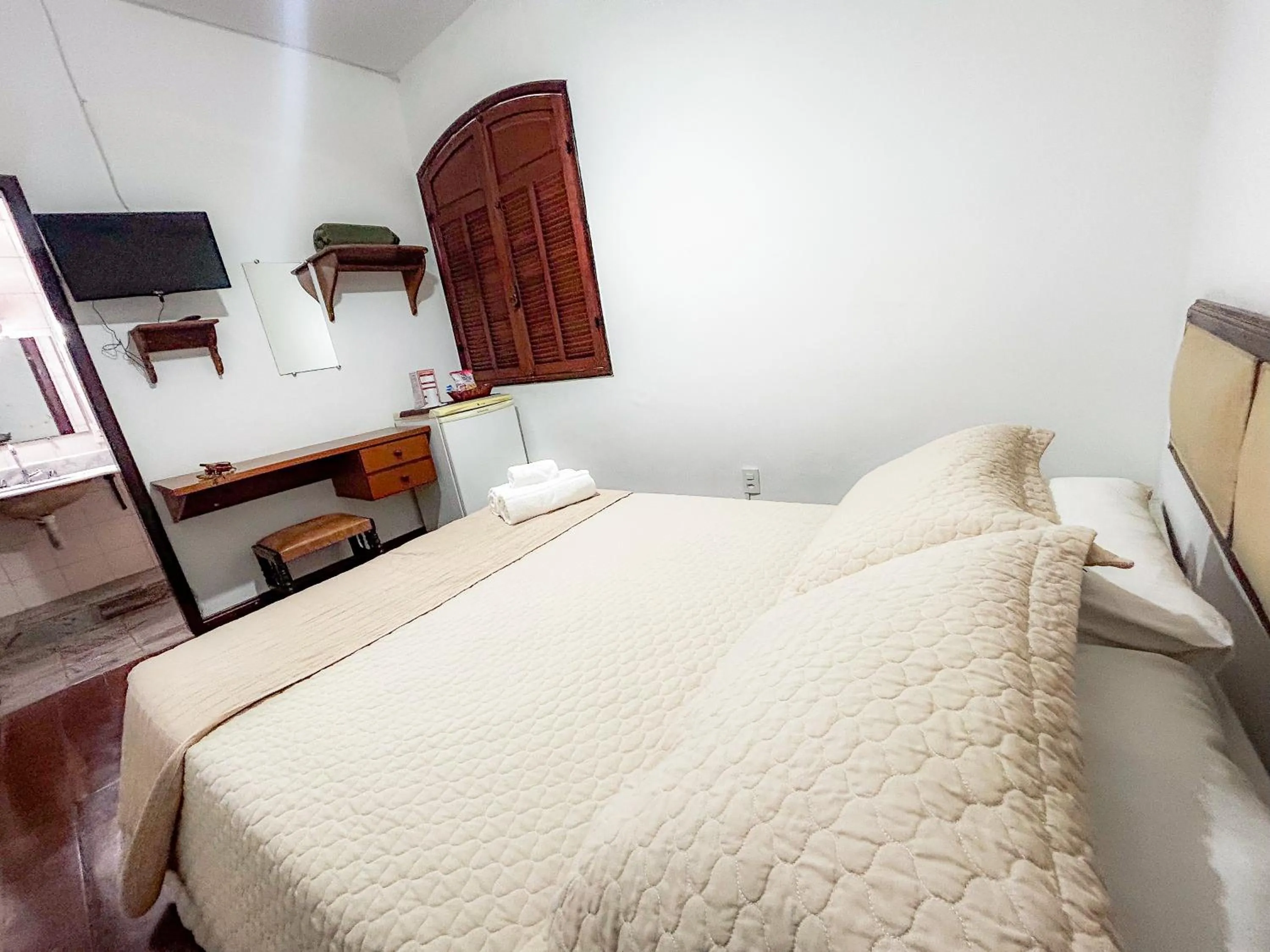 Bed in Pousada dos Sinos