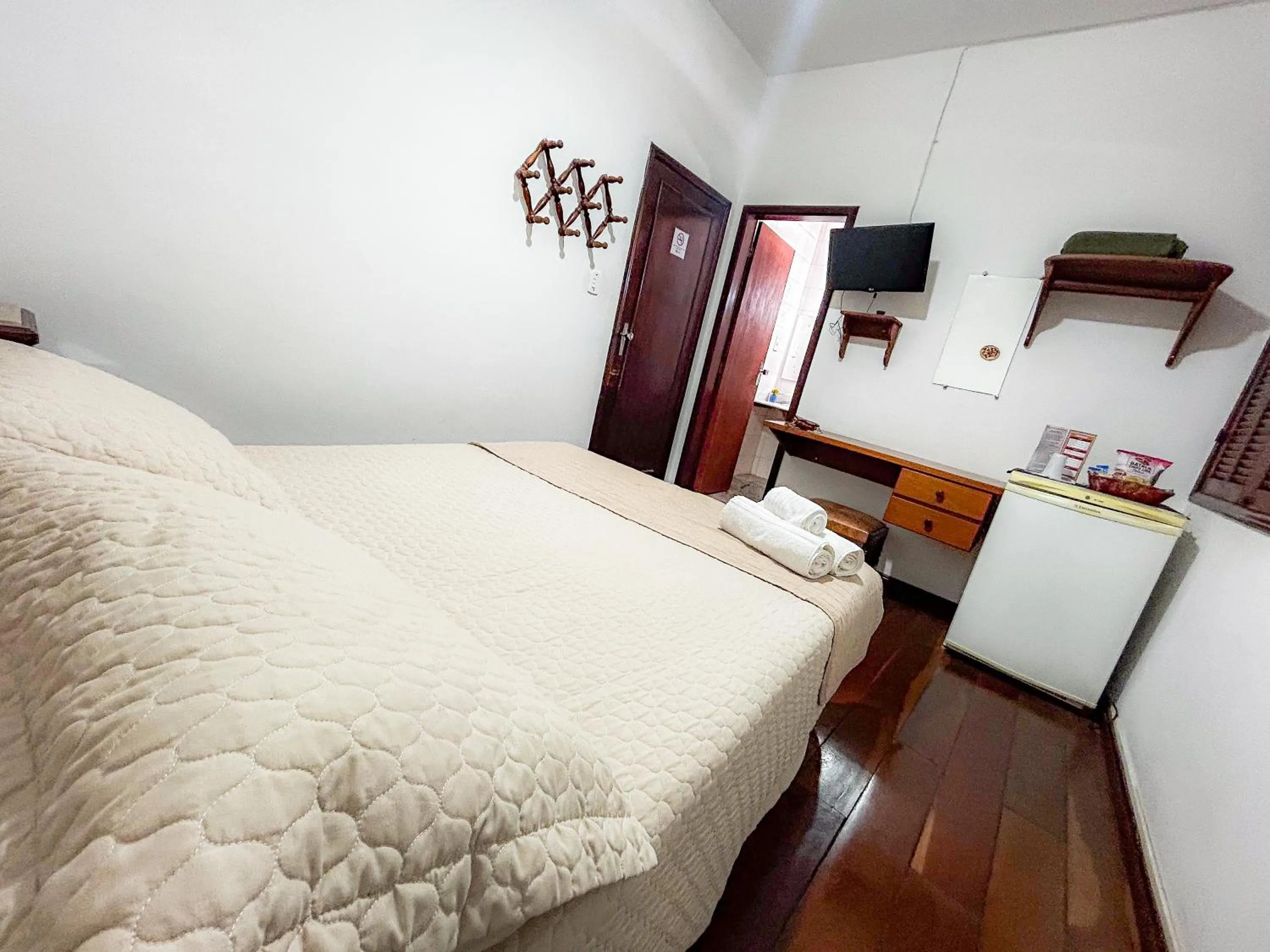 Bed in Pousada dos Sinos