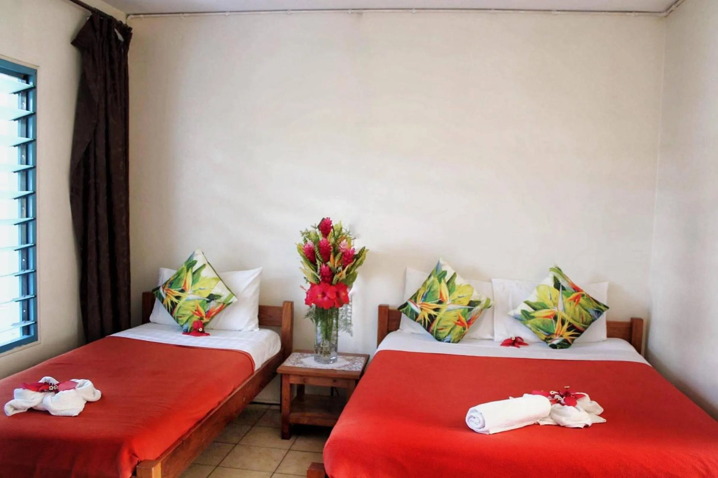 Bed in Pacific Paradise Motel