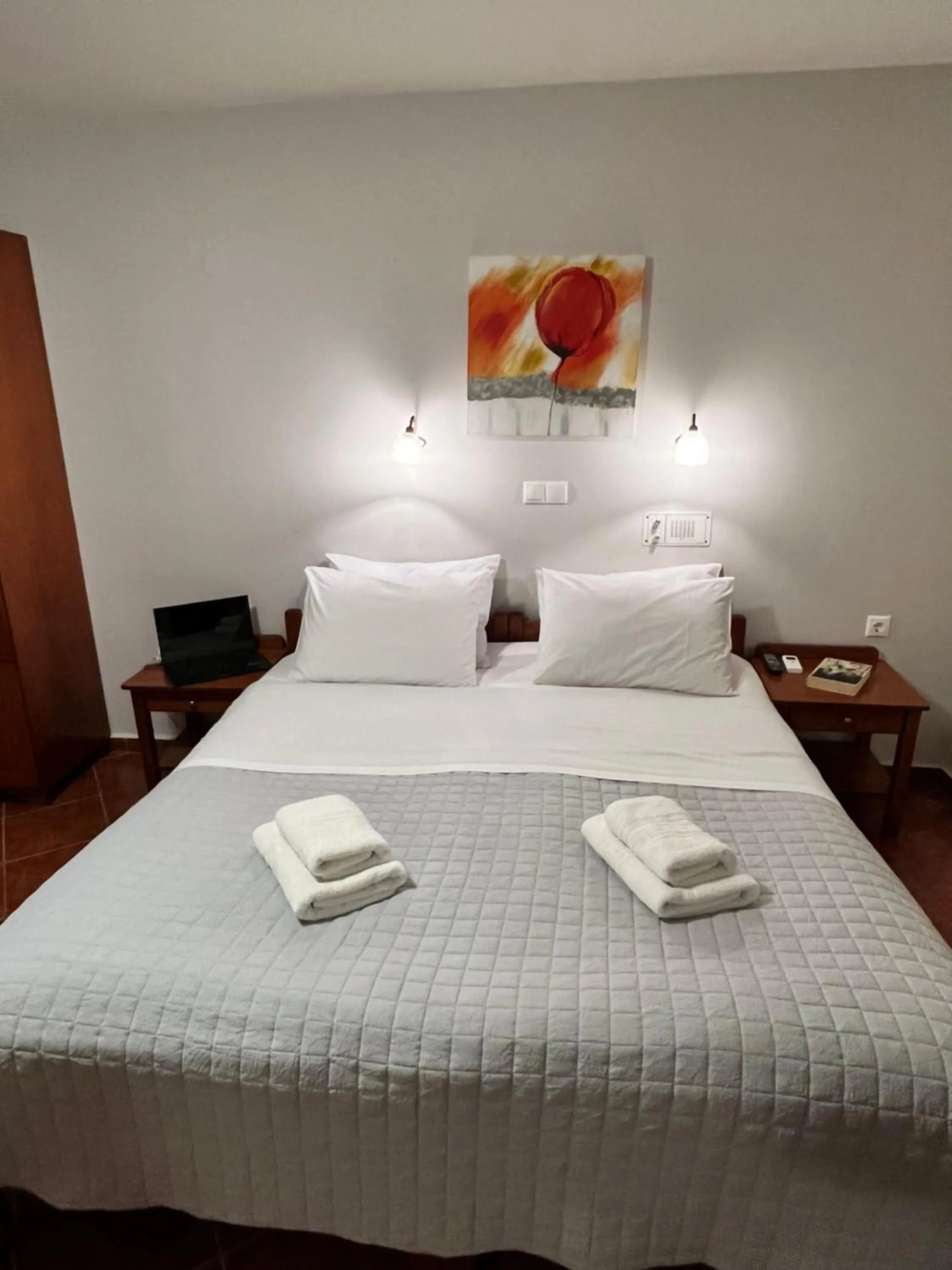 Bed in Iolkos Hotel Apartments