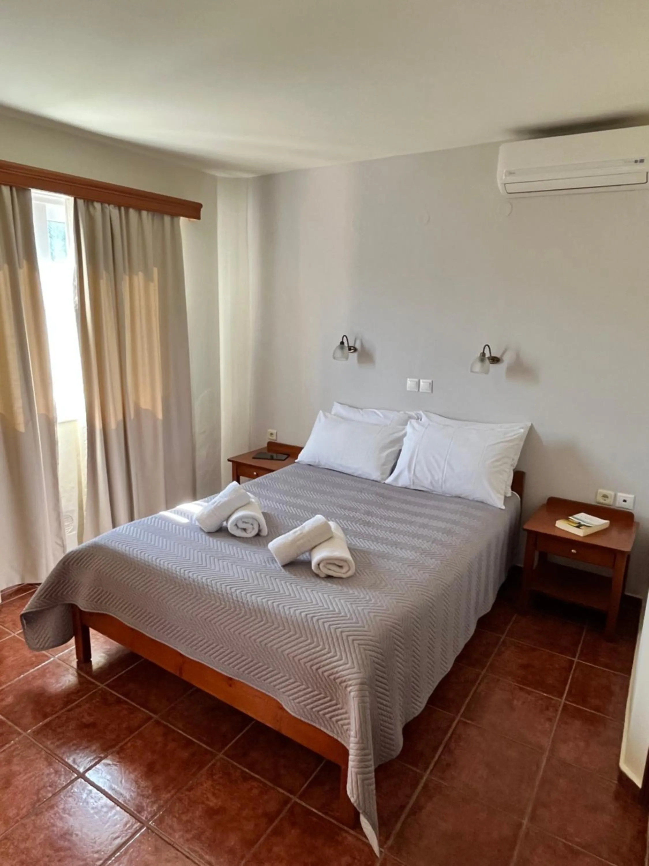 Bed in Iolkos Hotel Apartments