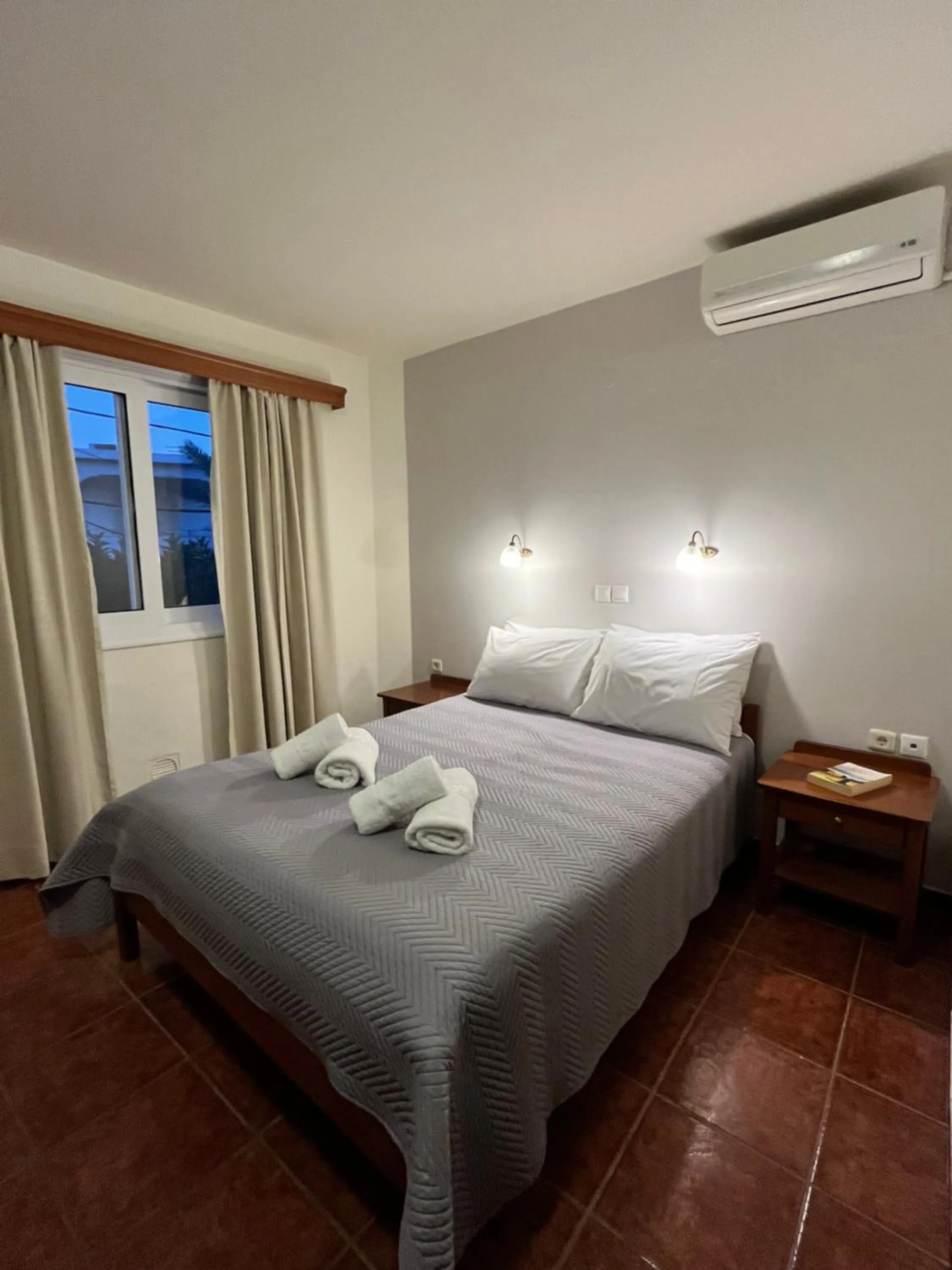 Bed in Iolkos Hotel Apartments