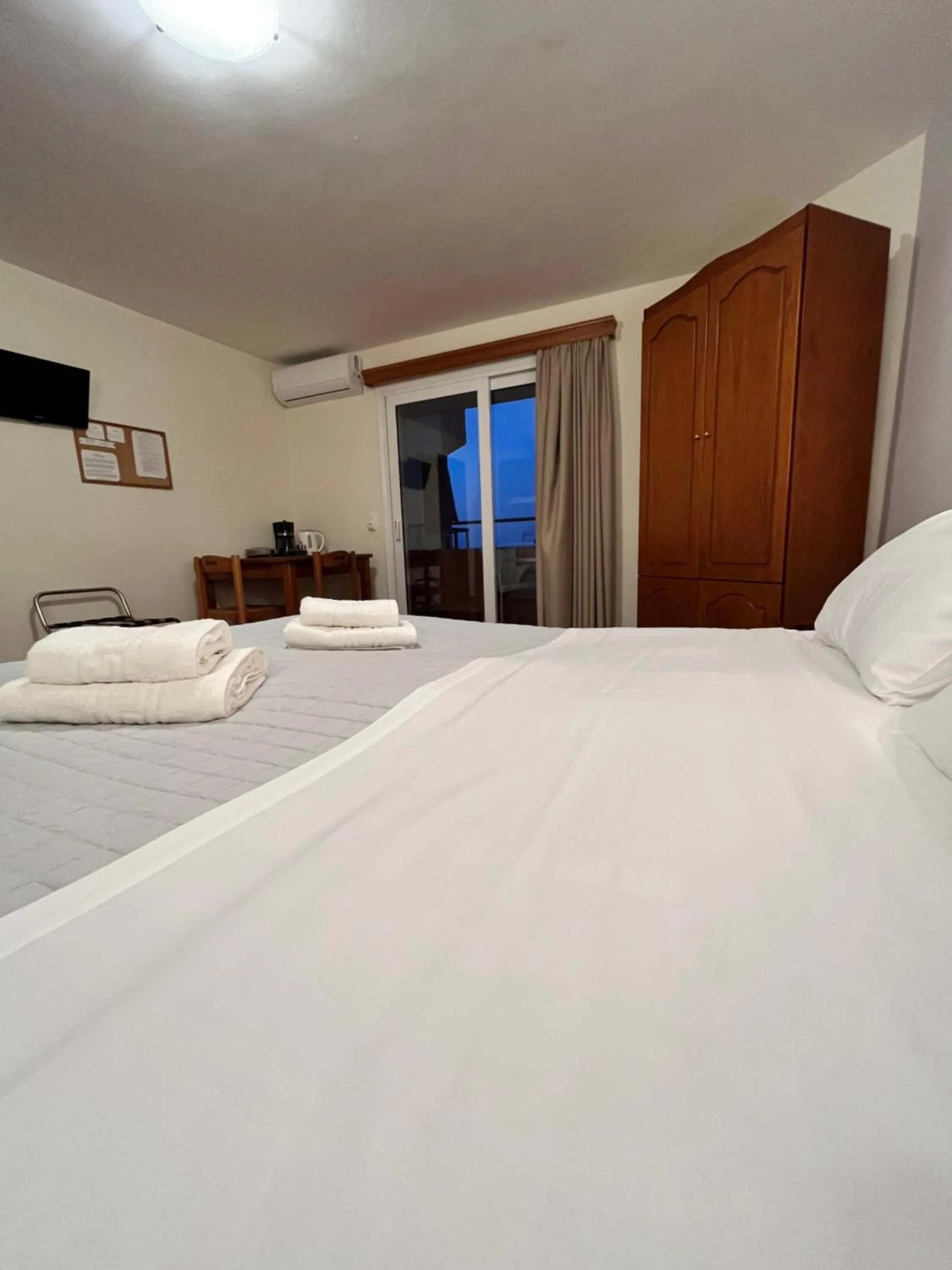 Bed in Iolkos Hotel Apartments