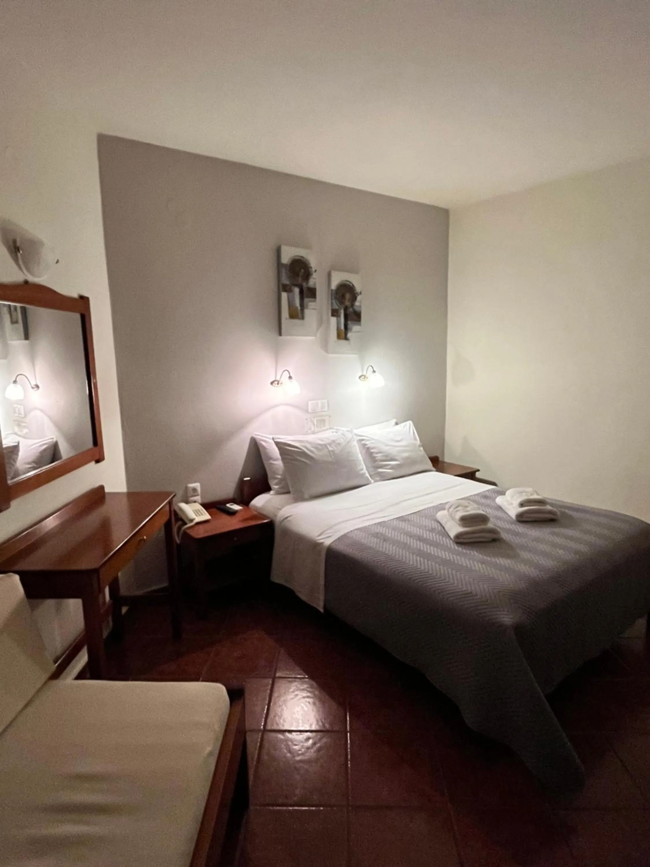 Bed in Iolkos Hotel Apartments