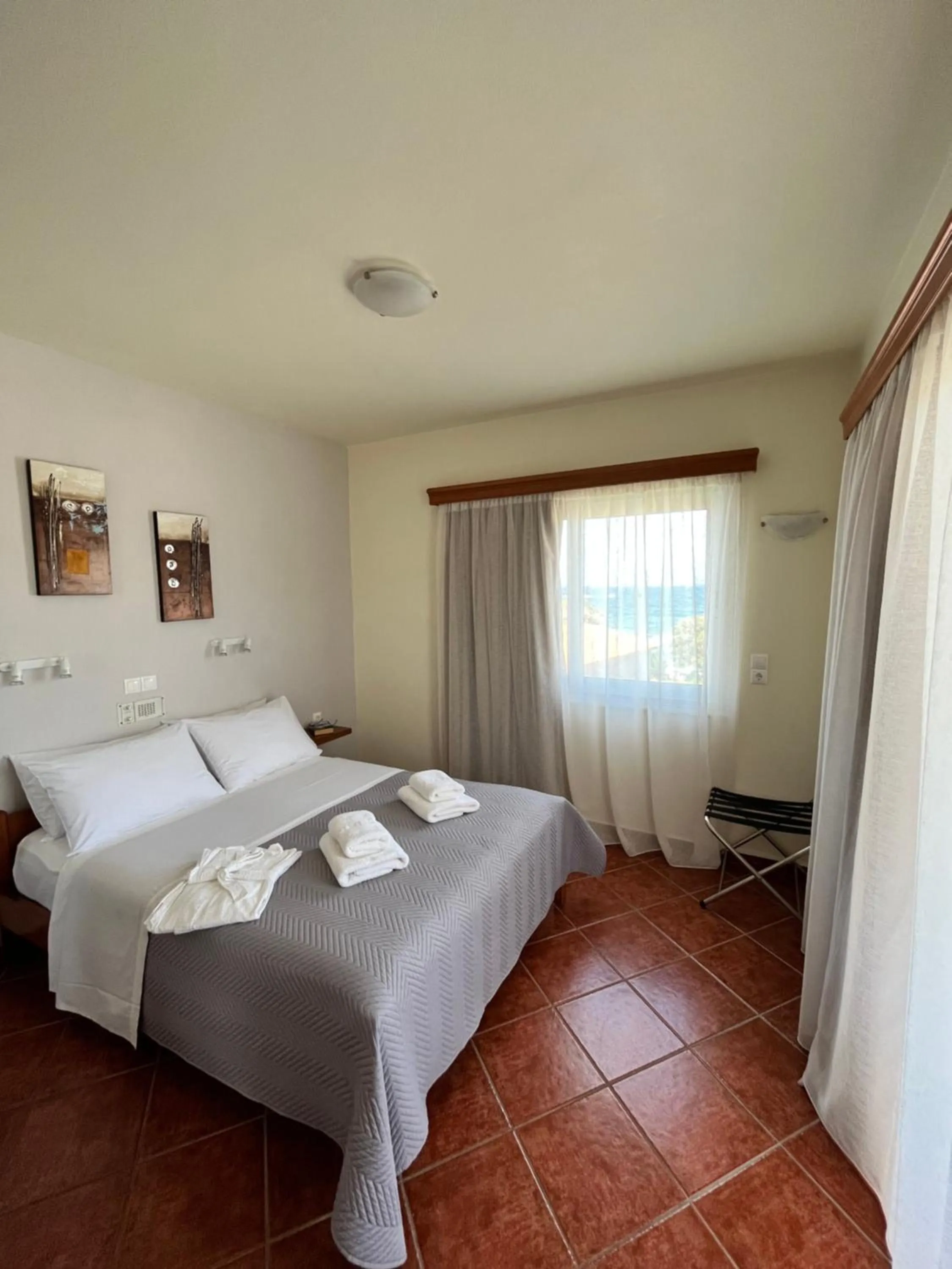 Bed in Iolkos Hotel Apartments