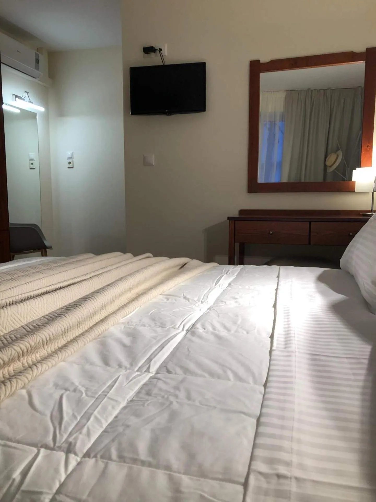 Bed in Iolkos Hotel Apartments