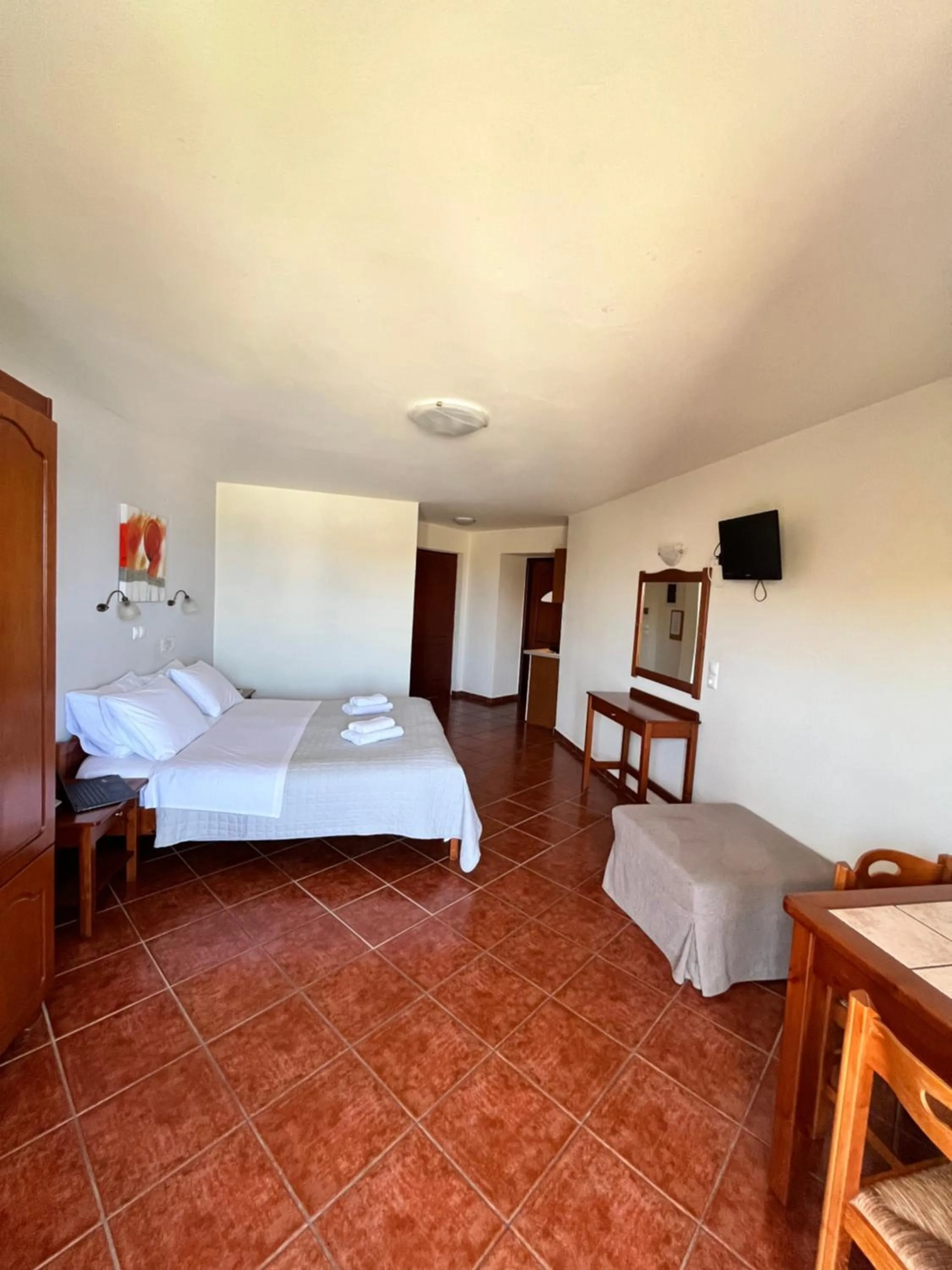 Bed in Iolkos Hotel Apartments