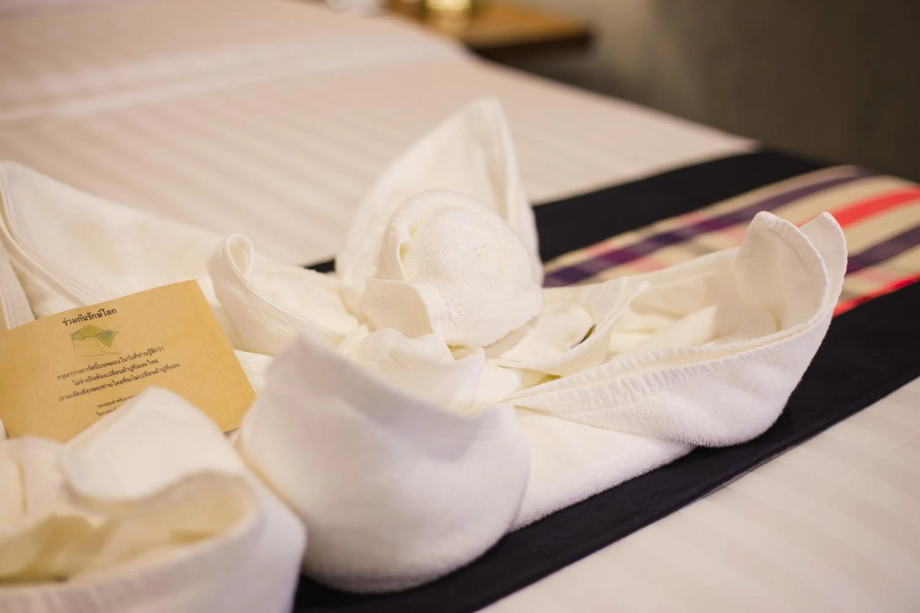 towels, Bed in NAI YA Hotel -SHA Extra Plus