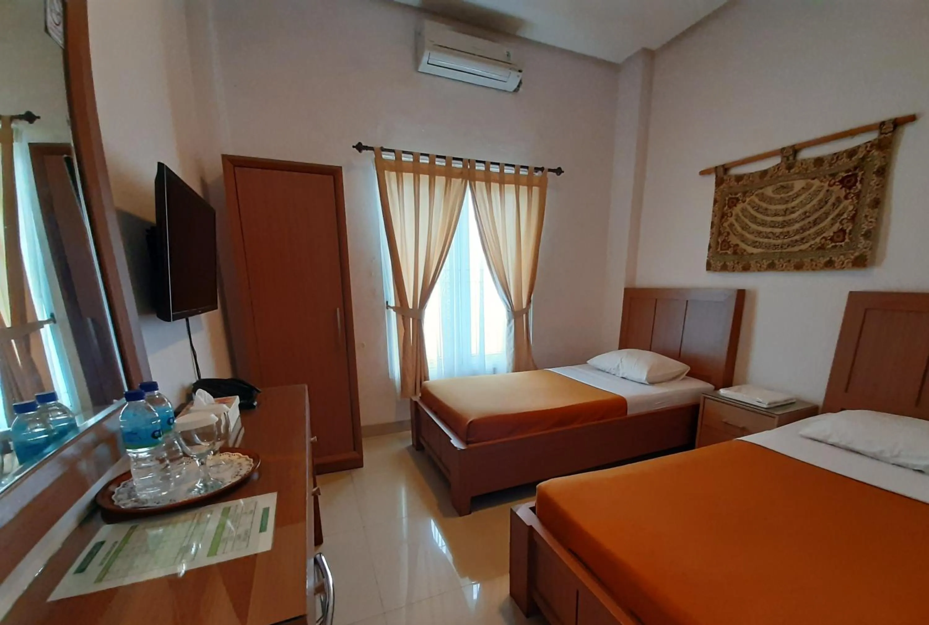 Bed in The Sriwijaya Hotel - Halal Hotel