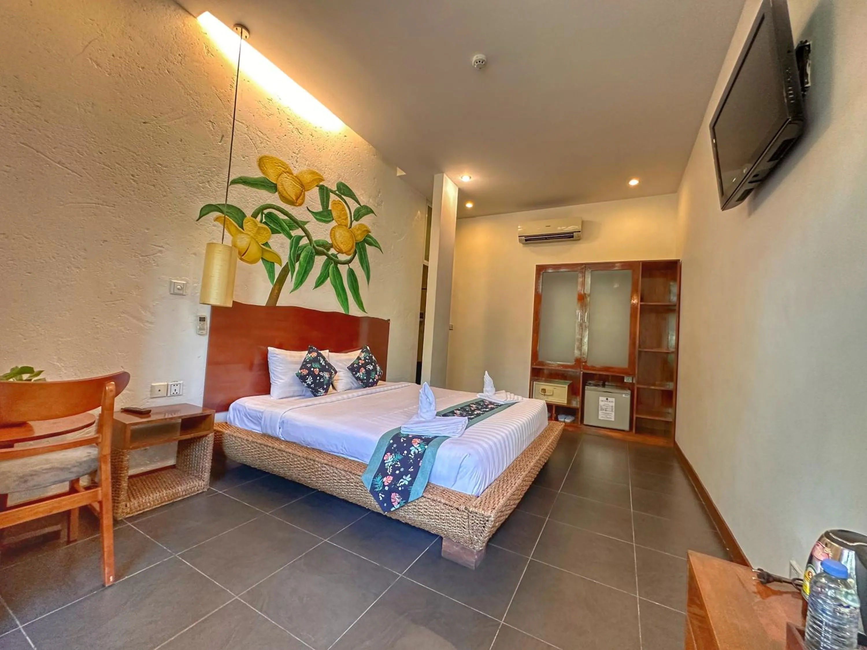 Bed in Monsoon Riverside Hotel