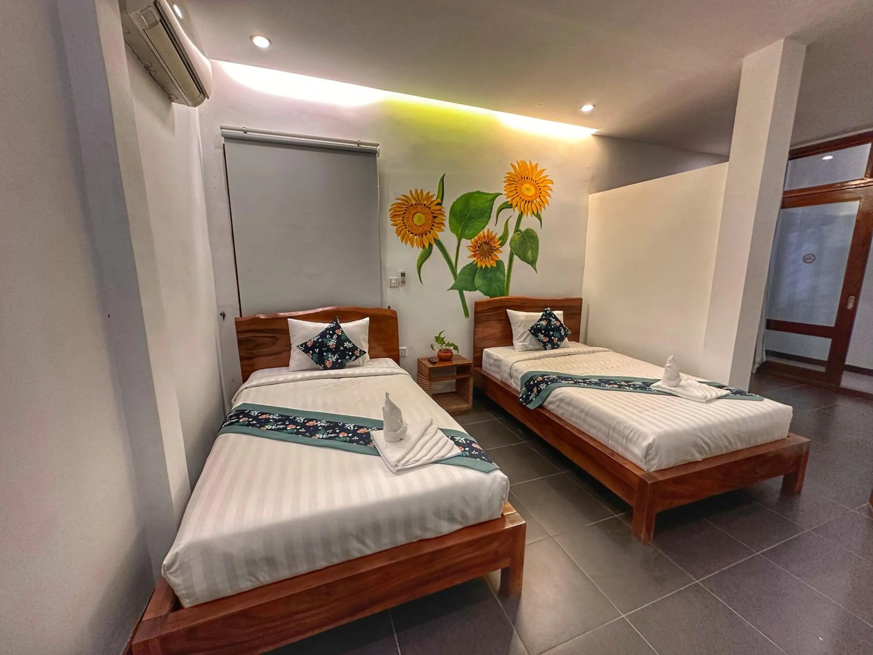 Bed in Monsoon Riverside Hotel