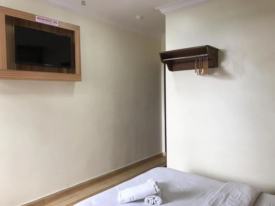 Bed in Haji Saudi Hotel