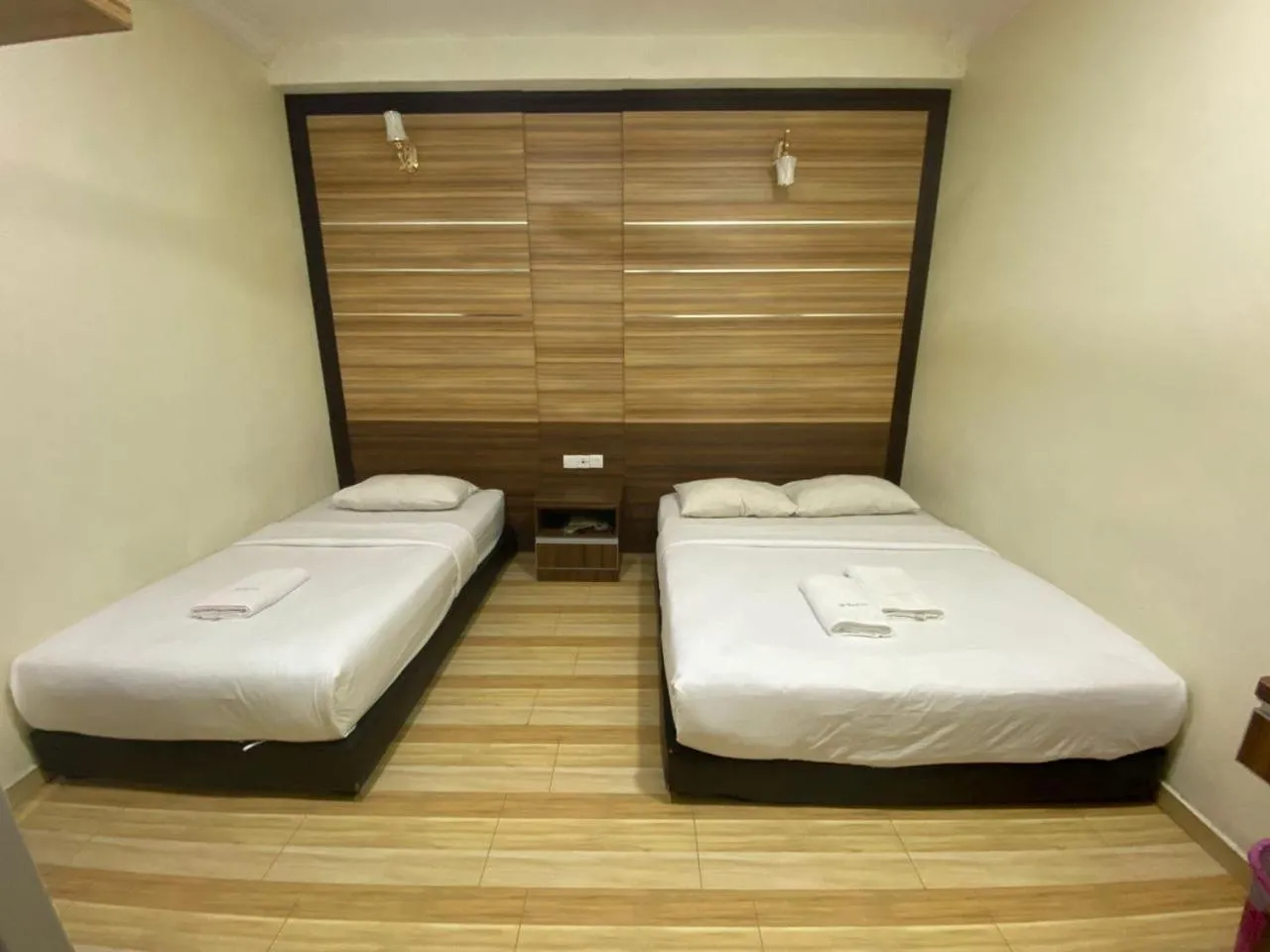 Bed in Haji Saudi Hotel