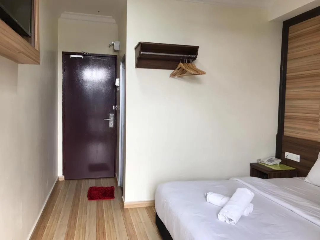 Bed in Haji Saudi Hotel