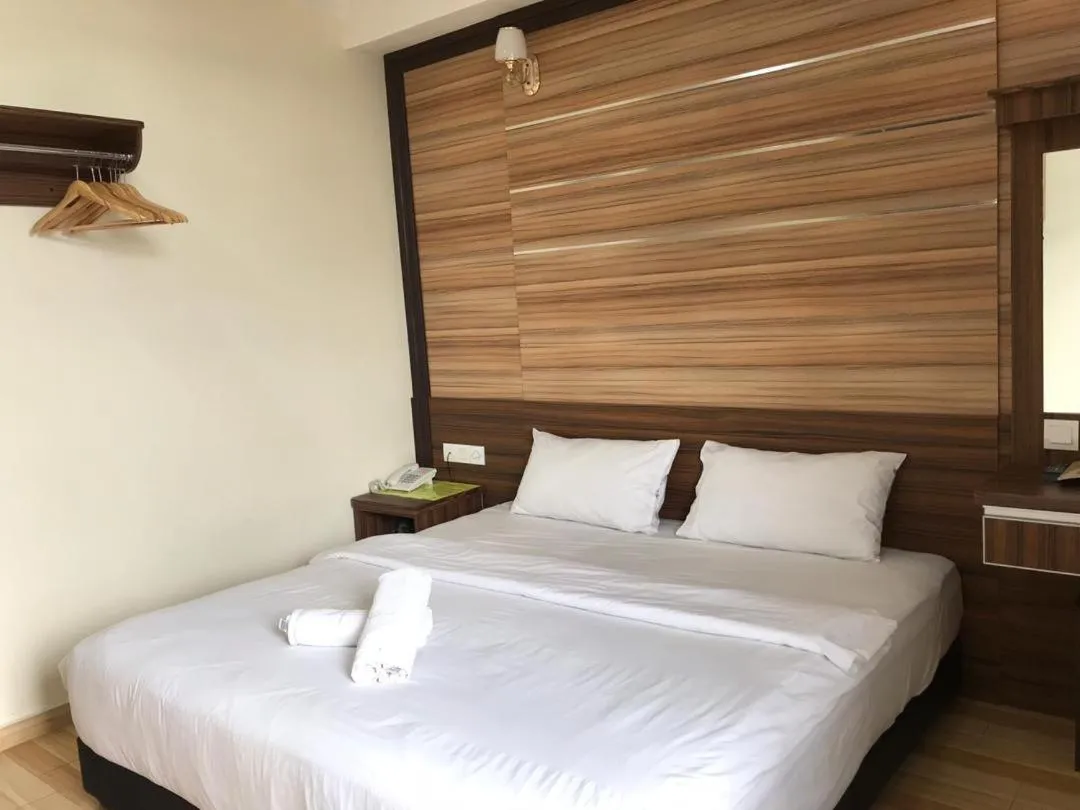 Bed in Haji Saudi Hotel