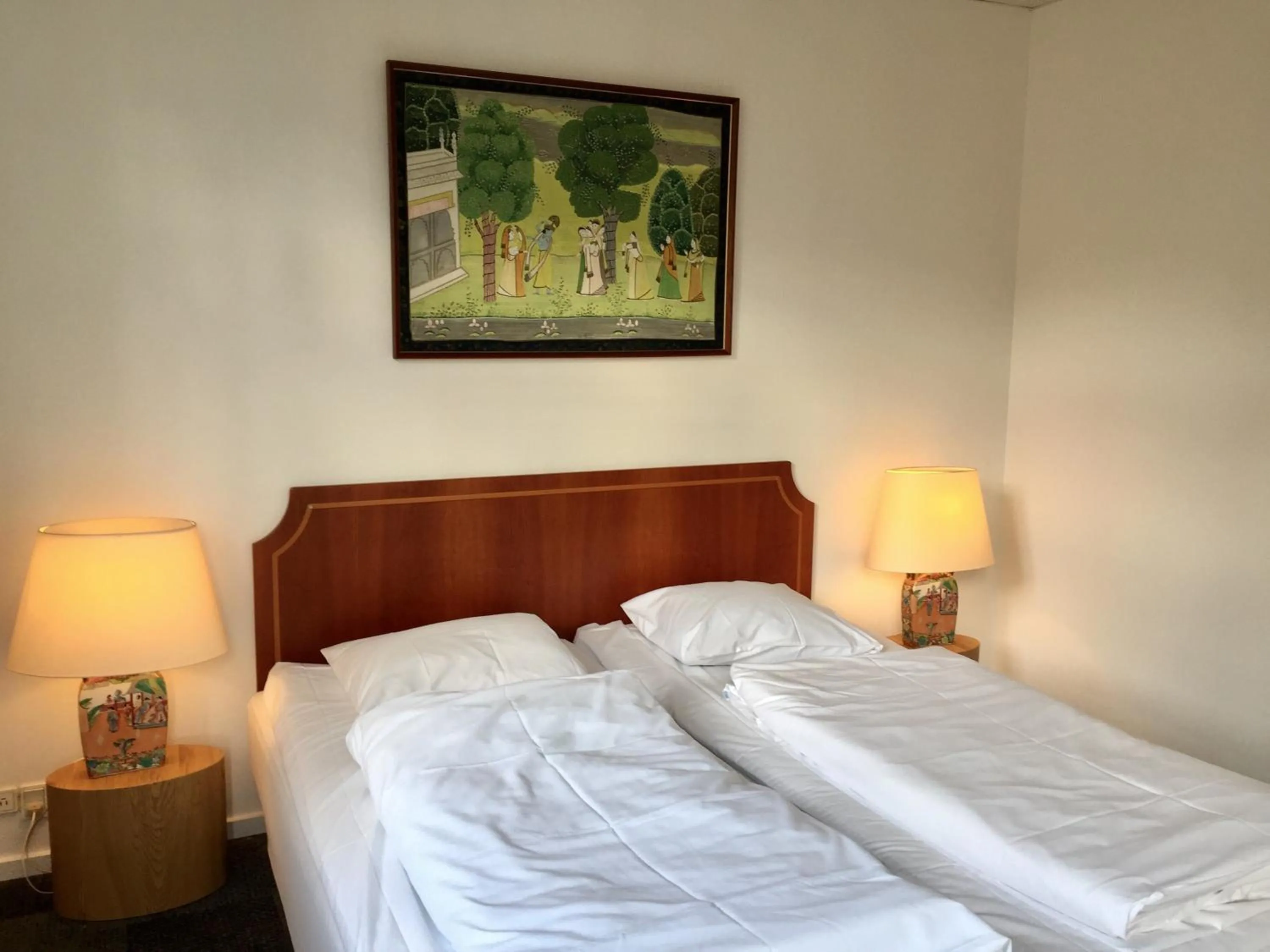 Bed in City Hotel Apartments