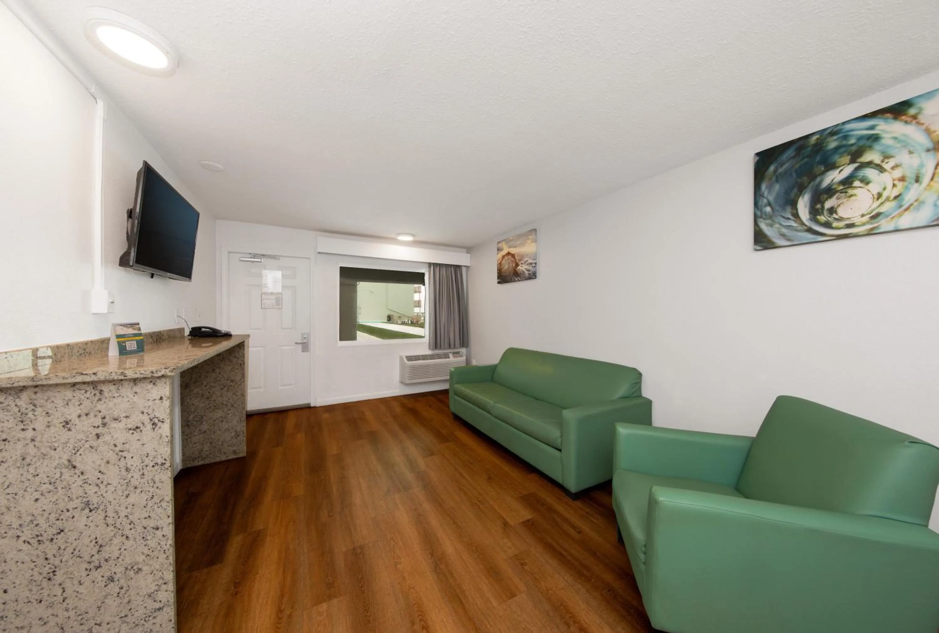 Living room in Chateau Beachfront Hotel, a By the Sea Resort